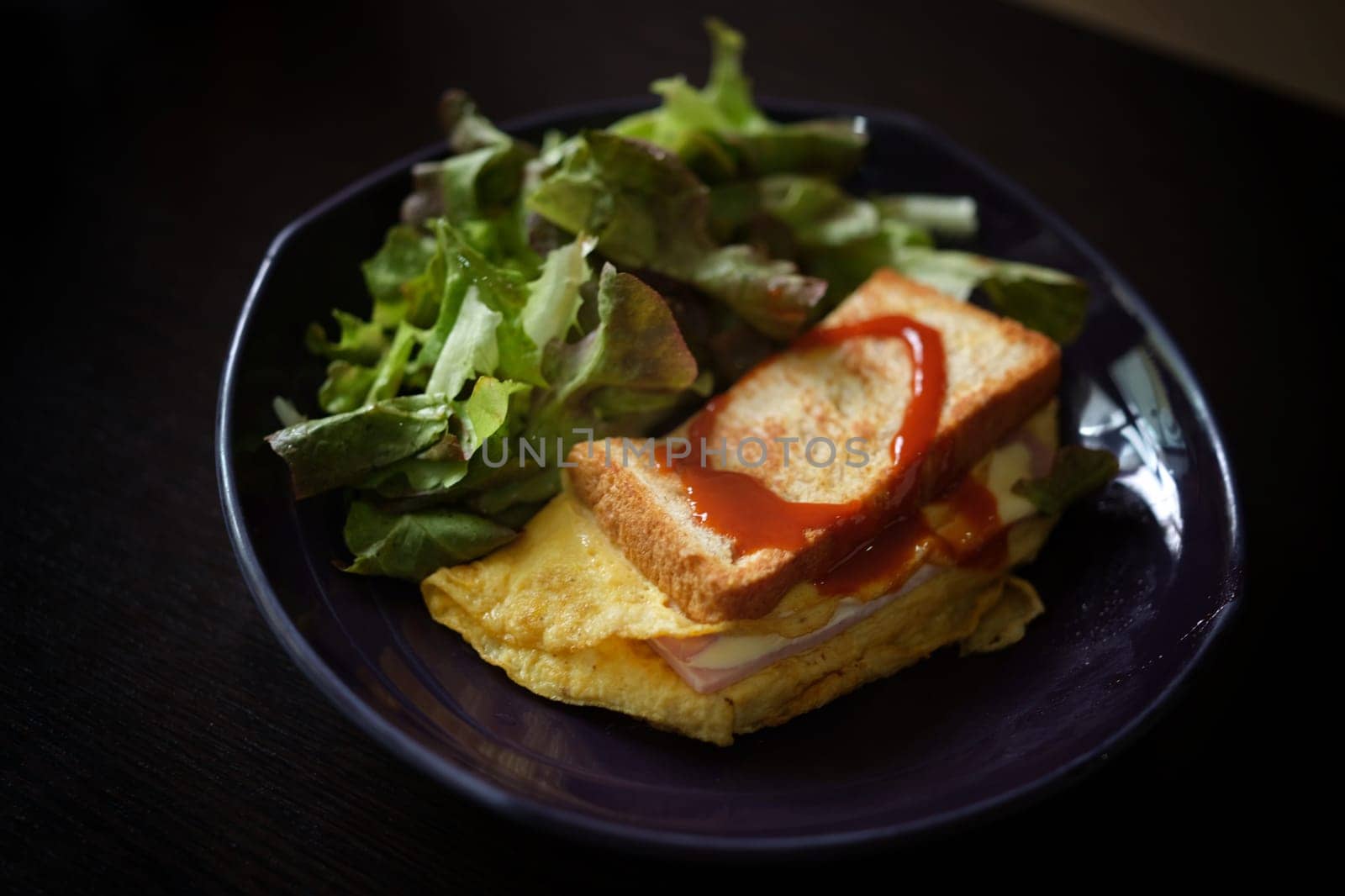 Sandwiches with egg, ham and toast cheese fried in dish