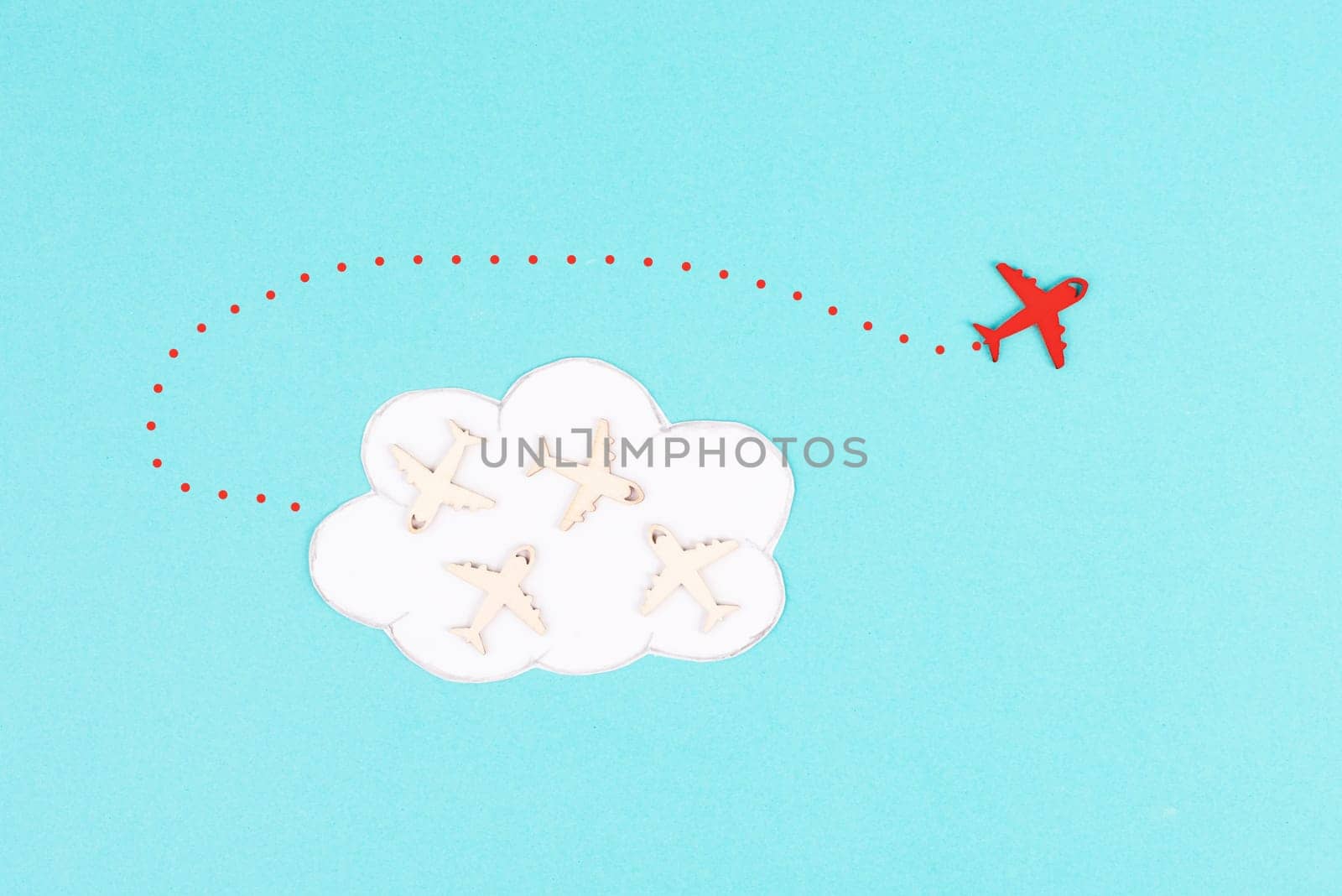 Group of airplanes flying in a cloud, red plane thinks different and takes the opposite direction, against the stream symbolic, courage and winner concept