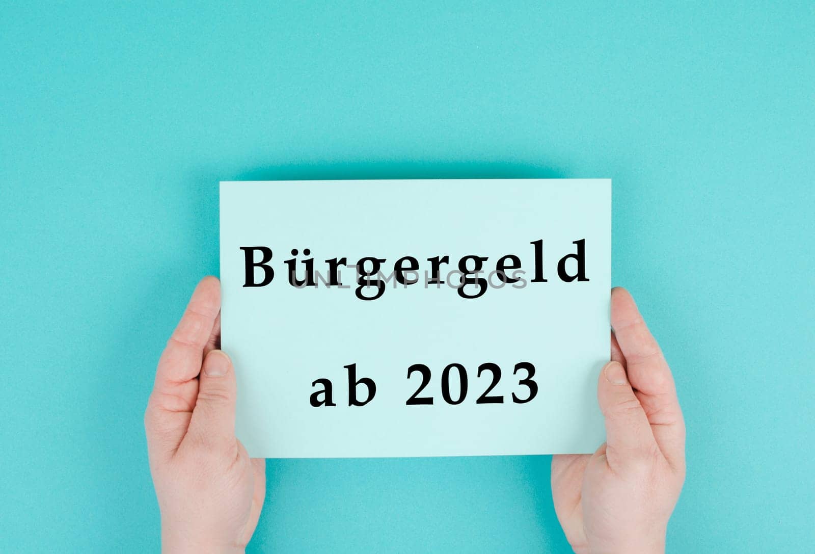 The german word for citizen money is standing on a paper, new financial help system for unemployment in Germany, social issue