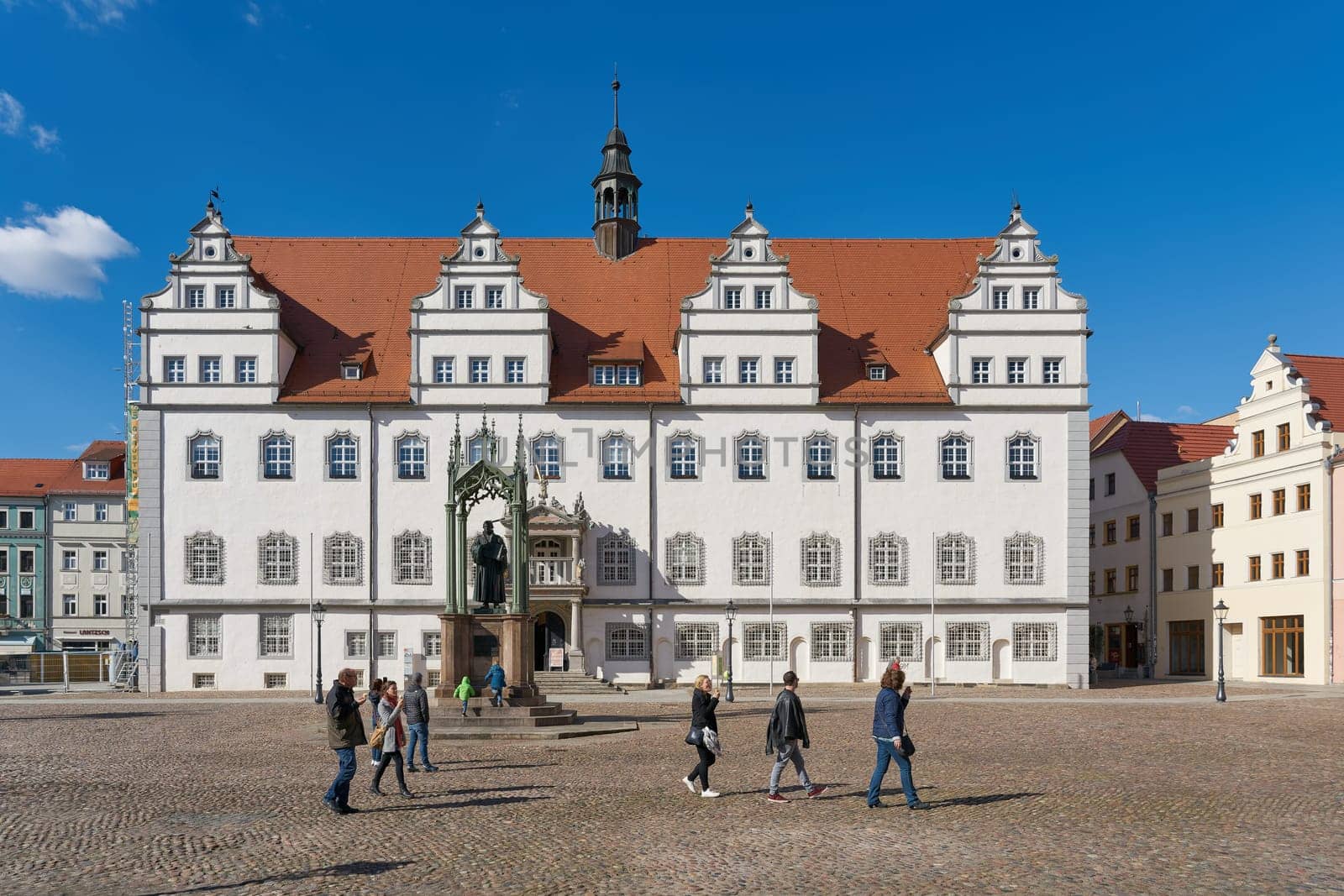 City Hall of Wittenberg with the monument of the reformer Martin Luther standing in front of it