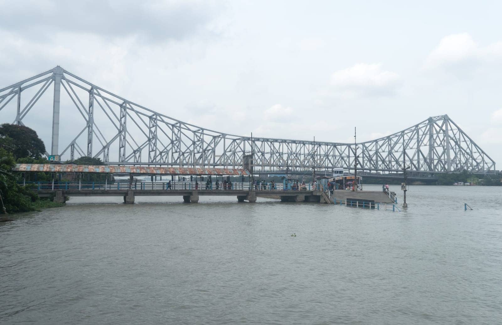The Howrah Bridge, a balanced attached cantilever bridge covering over the Hooghly River in West Bengal, India, South Asia Pacific June 28, 2022