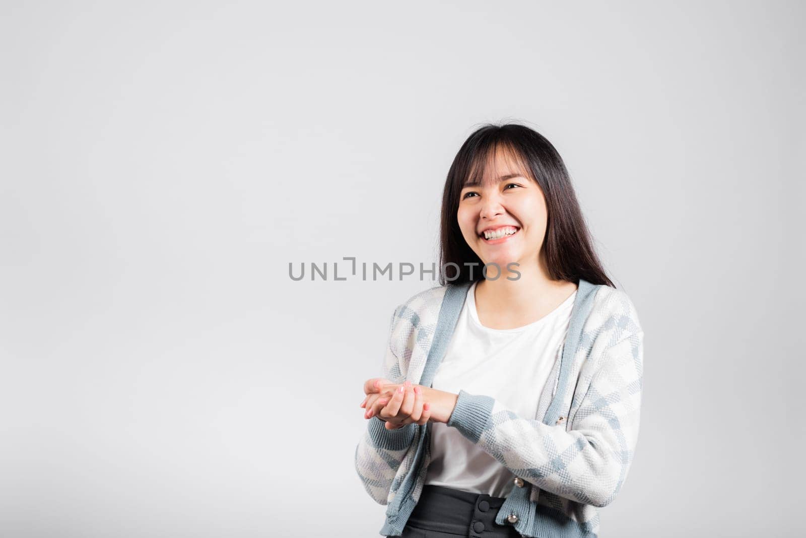 Woman winning and surprised excited screaming laughing studio shot isolated white background, Happy Asian portrait beautiful young female lifestyle cheerful smiling and laugh funny with copy space