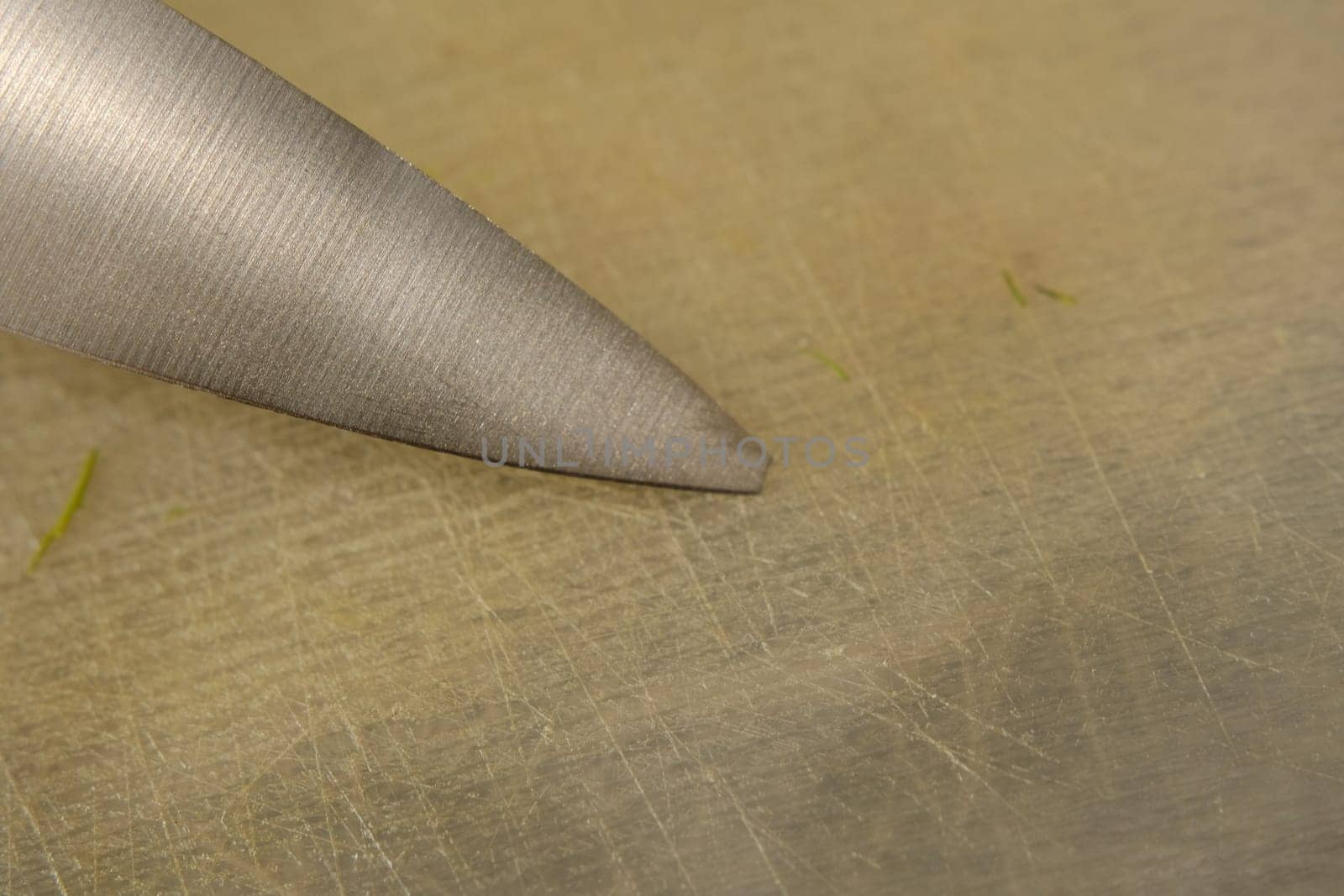 close up old knife with a chipped blade. broken substandard knife, broken end of the knife.