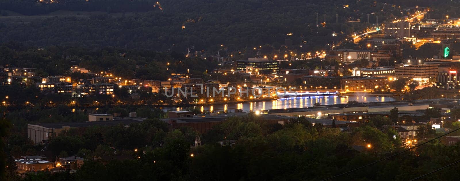 Sherbrooke downtown at night Magog river and streets lights buildings cityscape french culture in Quebec, Canada