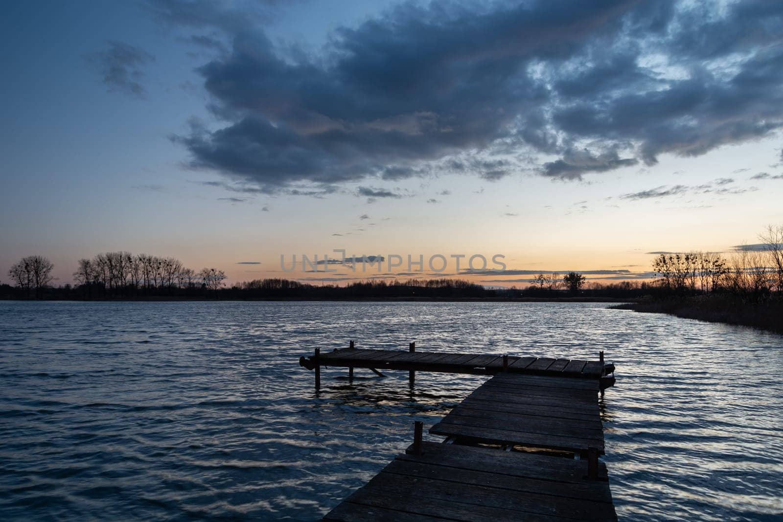 Wooden pier on the lake and the evening sky, Stankow, Poland