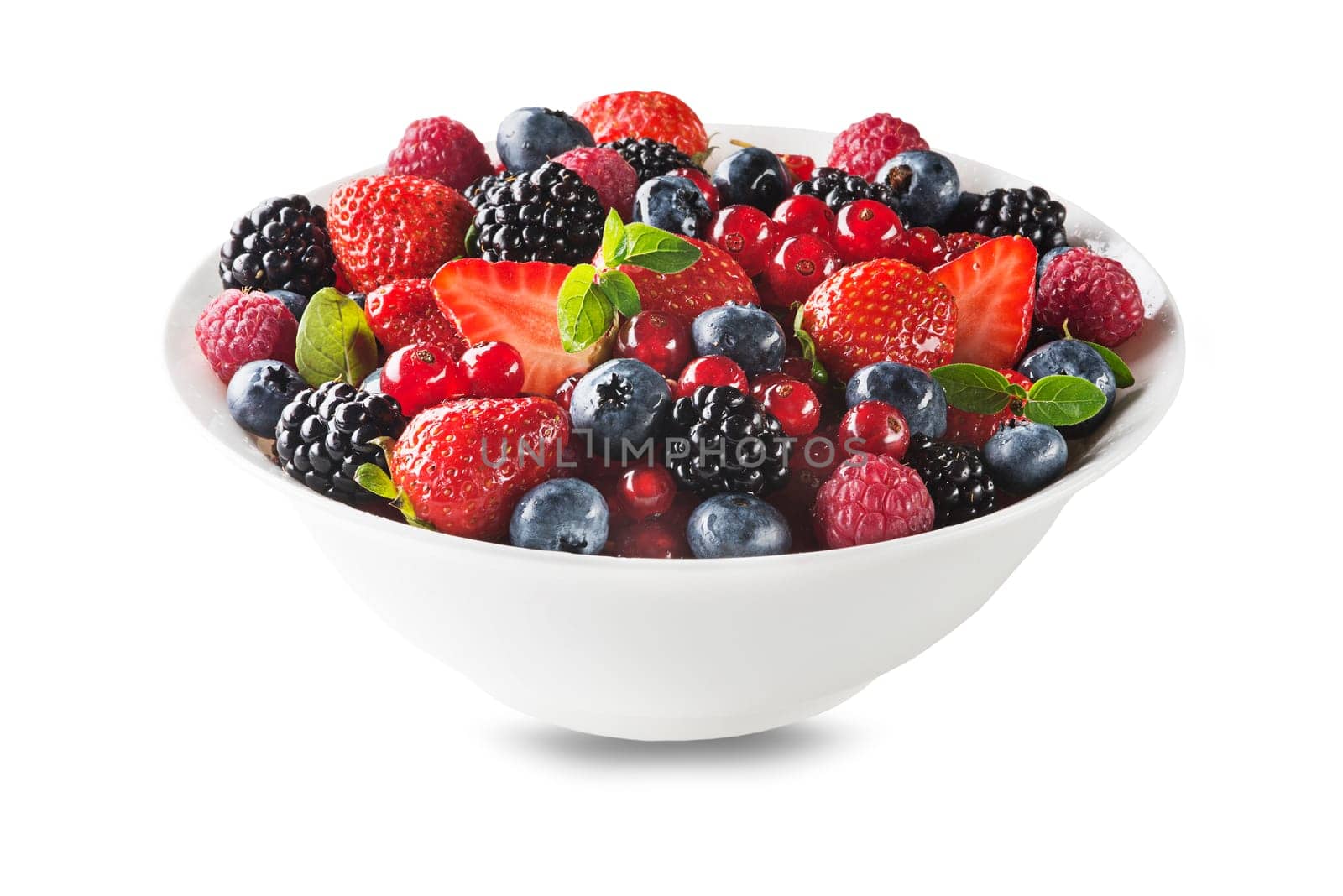 Bowl of healthy fresh berry fruit salad isolated on white background