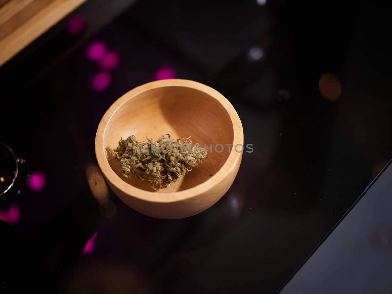 Medical marijuana flower buds. Recreational marijuana strain. Cannabis strain. Weed bud in wood bowl .