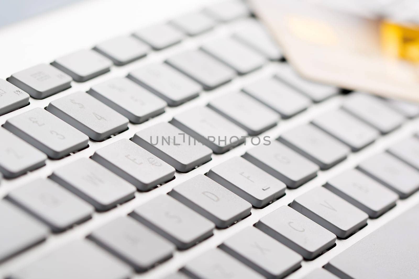 Macro of a credit cards on a computer keyboard.