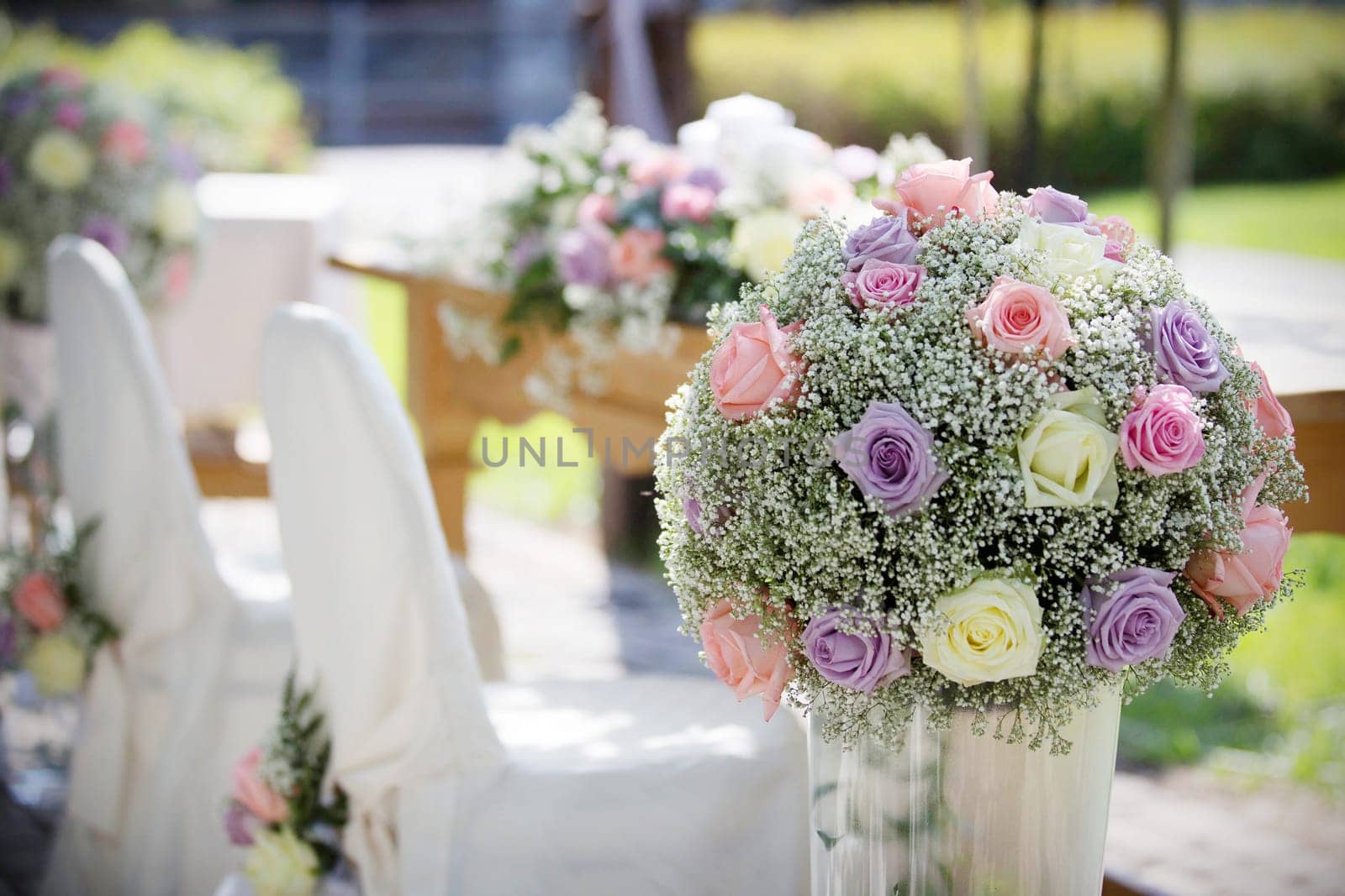 Wedding Chair Cover and Fresh Roses in a Wedding Day