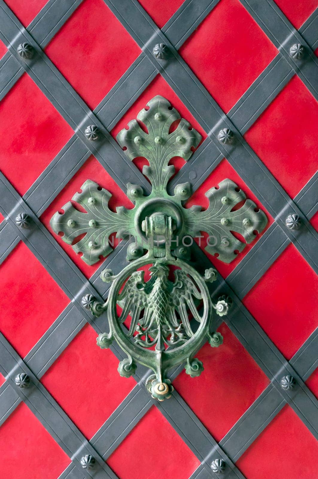 Close up view of an ornamental castle door knocker.