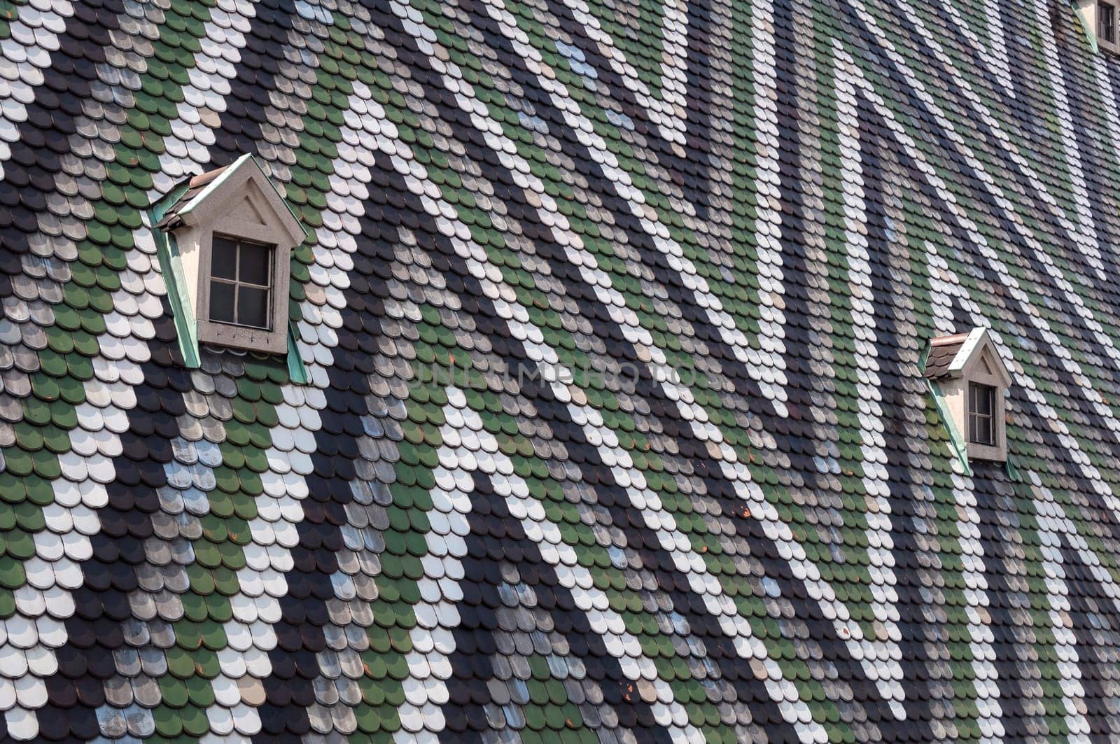 Detailed view of colorful wooden roof shingles.