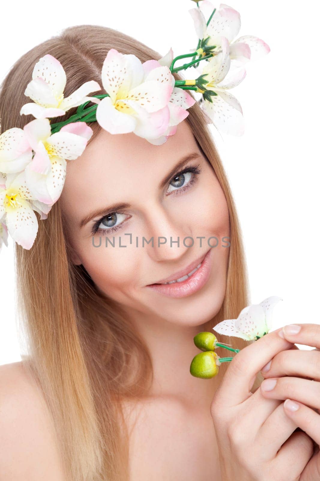 Beautiful young blonde woman with a crown of flowers