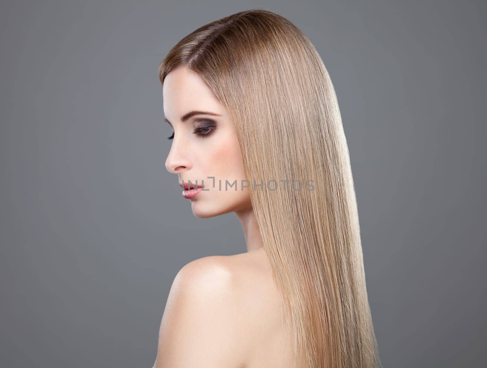 Profile of a beauty with long straight blonde hair