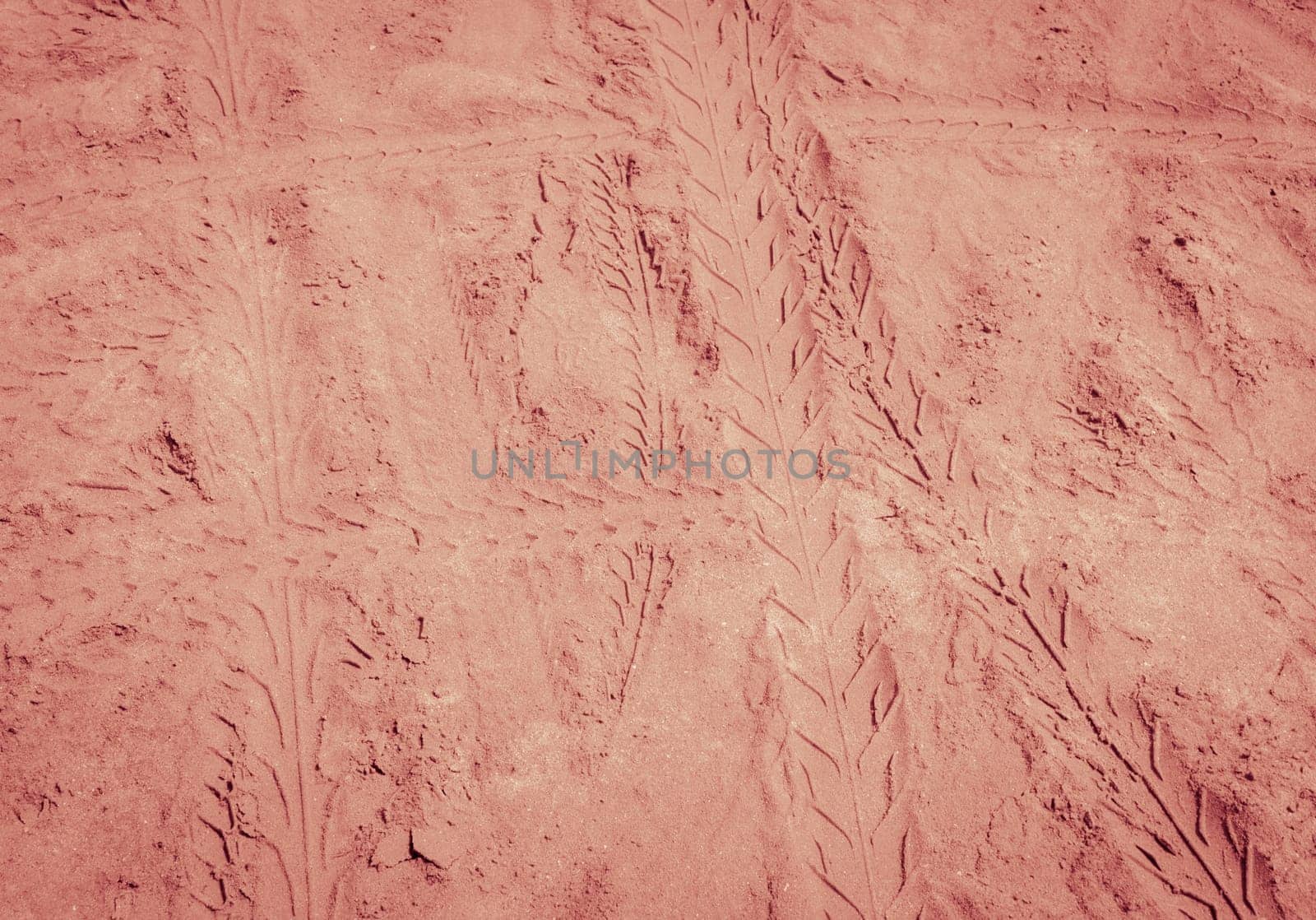 Tyre tracks texture on sand beach background in vintage style color
