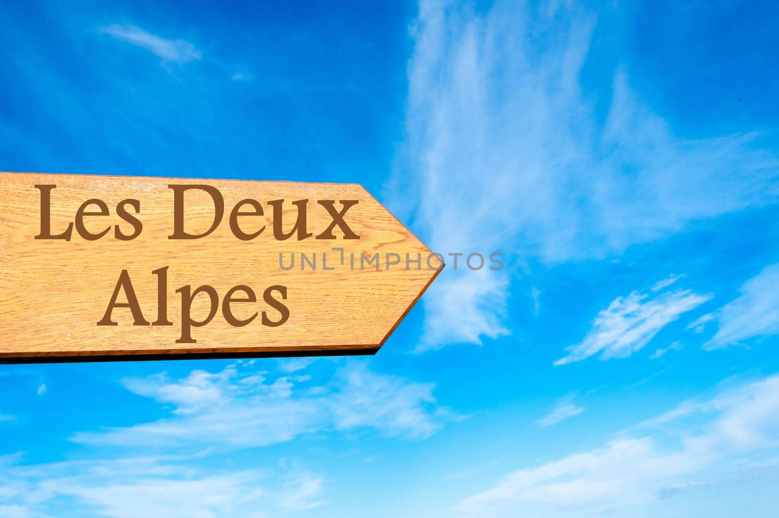 Wooden arrow sign pointing destination Versailles, FRANCE against clear blue sky with copy space available. Travel destination conceptual image