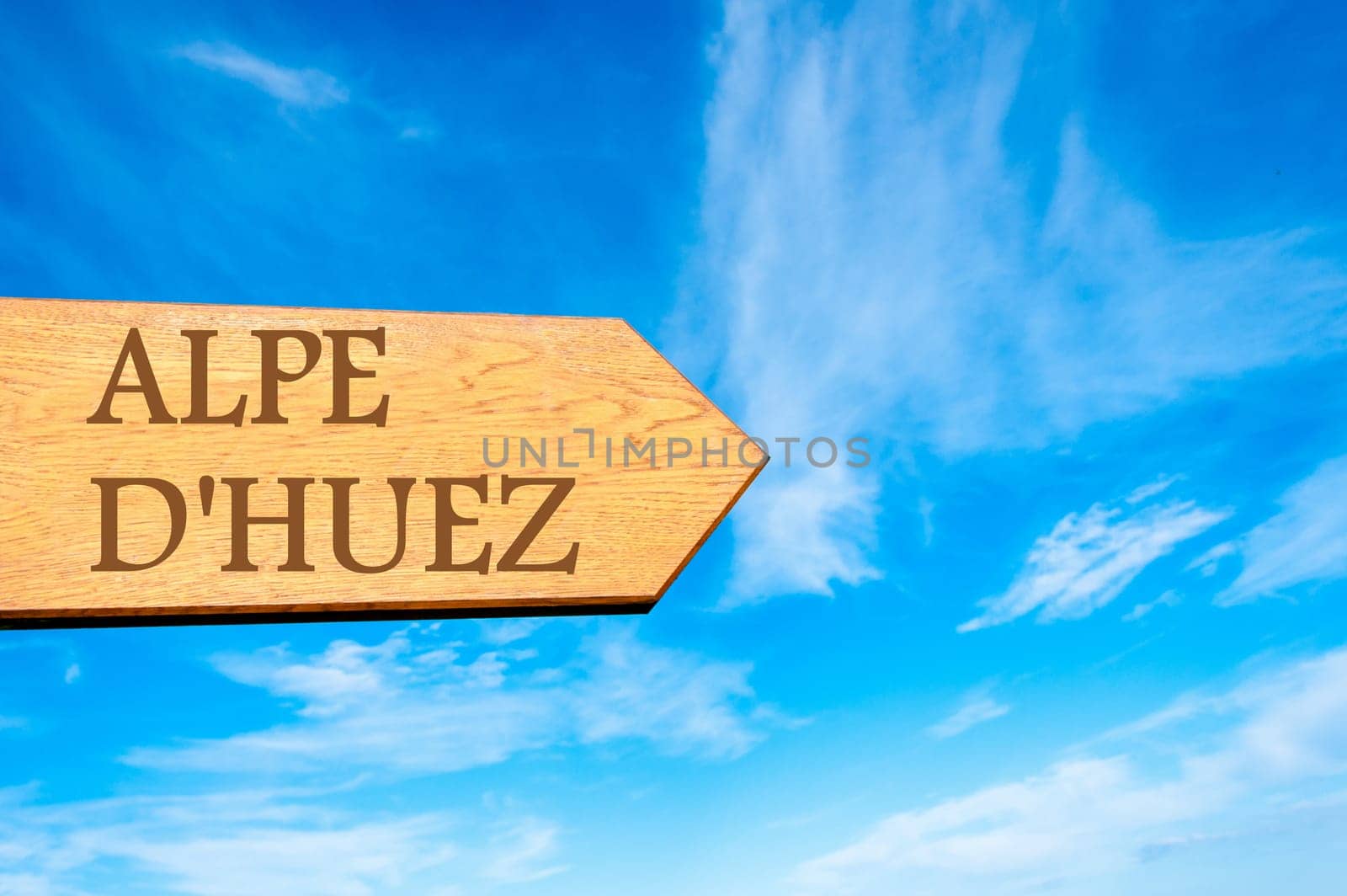 Wooden arrow sign pointing destination TALLINN, ESTONIA against clear blue sky with copy space available. Travel destination conceptual image