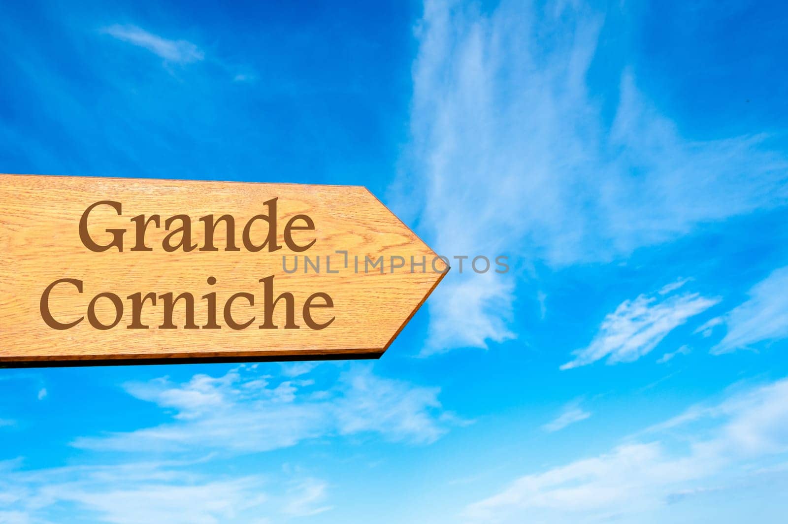 Wooden arrow sign pointing destination Versailles, FRANCE against clear blue sky with copy space available. Travel destination conceptual image