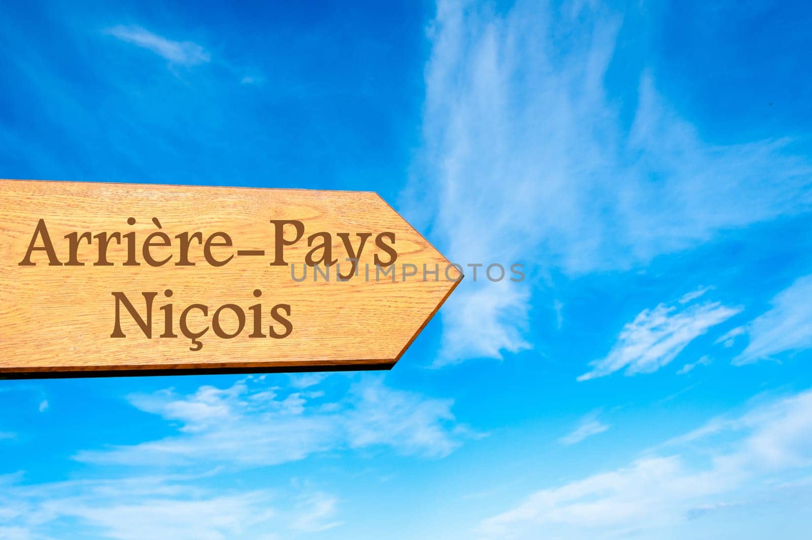 Wooden arrow sign pointing destination Versailles, FRANCE against clear blue sky with copy space available. Travel destination conceptual image