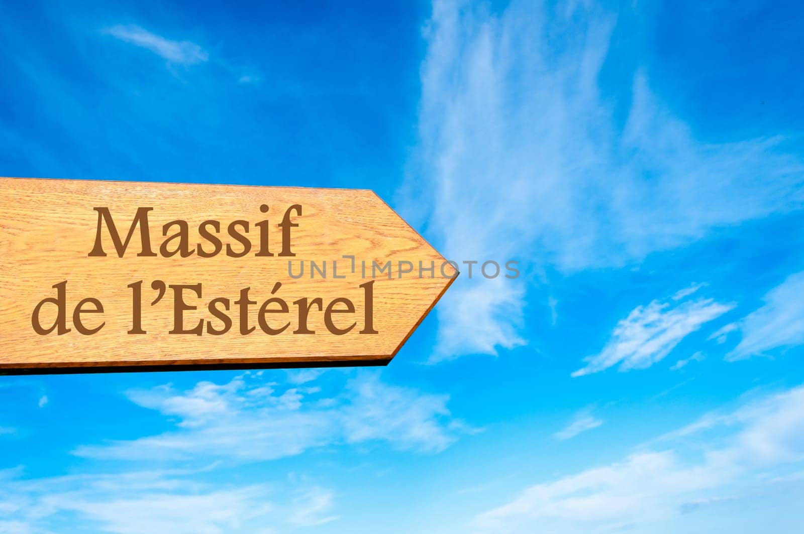 Wooden arrow sign pointing destination Versailles, FRANCE against clear blue sky with copy space available. Travel destination conceptual image