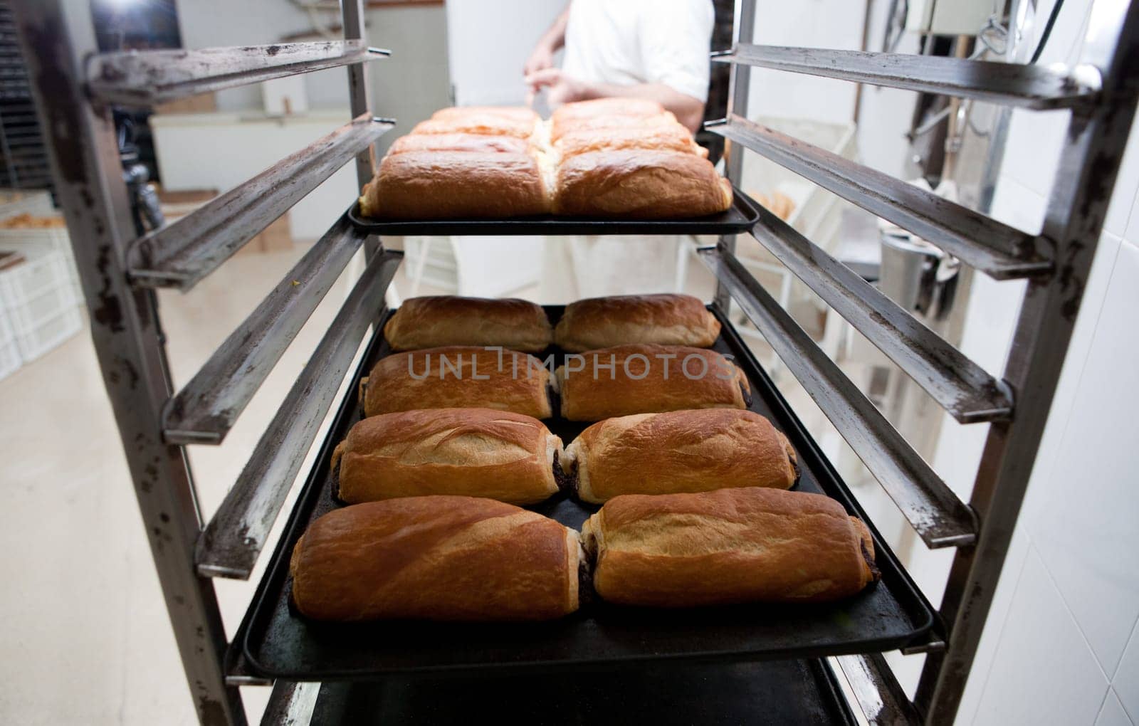Racks of freshly baked neapolitan cakes