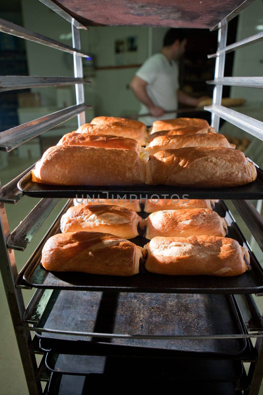 Racks of freshly baked neapolitan cakes