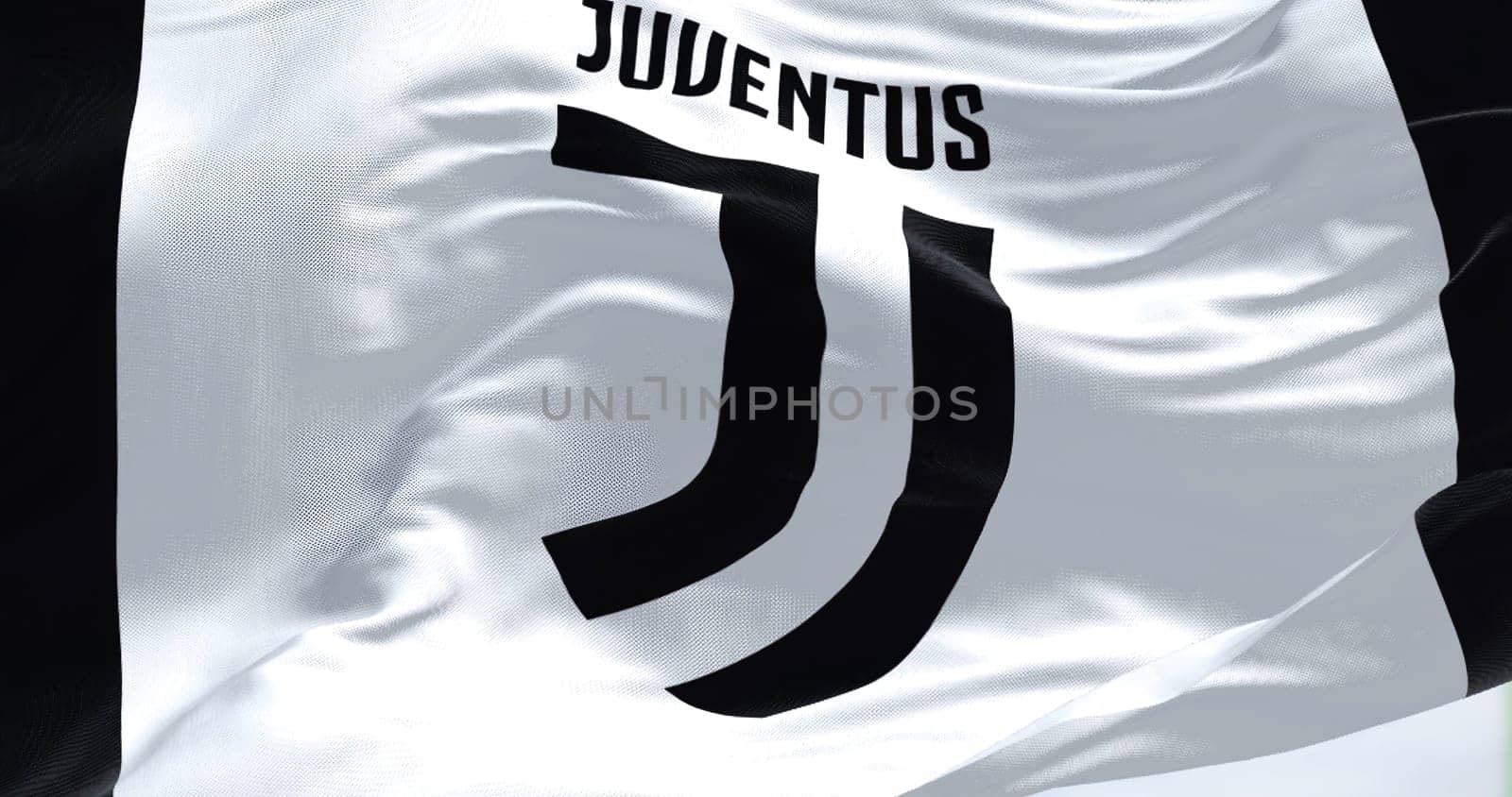 Turin, Italy, July 2022: The flag of Juventus Football Club waving. Juventus is a professional football club based in Turin. Italy