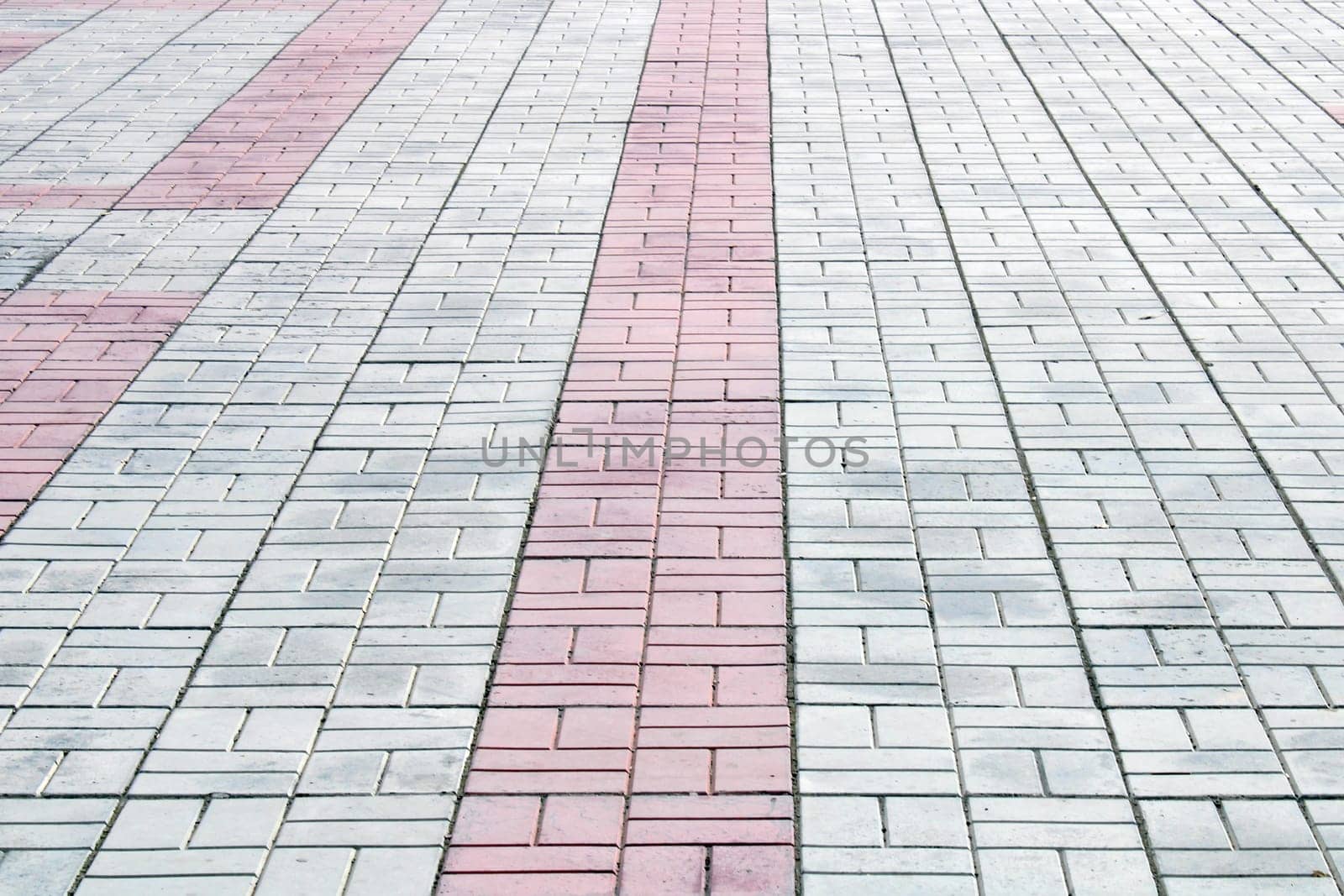 Sidewalk white, gray, red tiles. Architecture, construction. Abstract curly background..