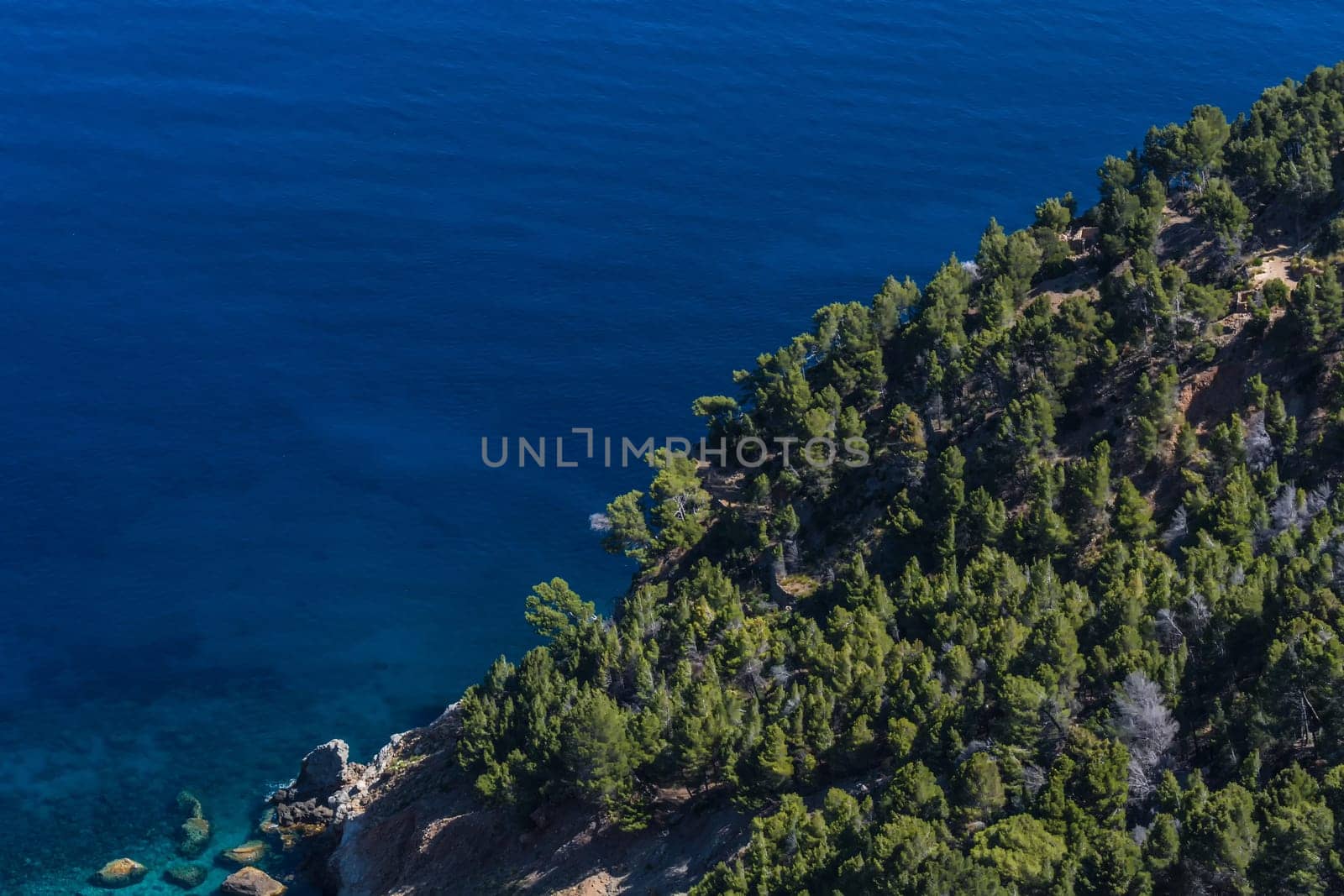 Sea waves and rocks on the steep west coast of Mallorca.