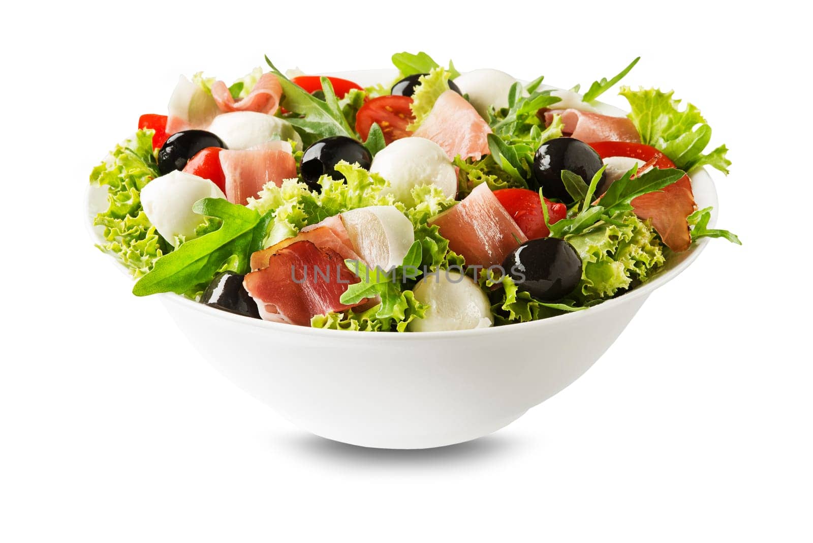 Healthy green salad with prosciutto, mozzarella and vegetables isolated on white background