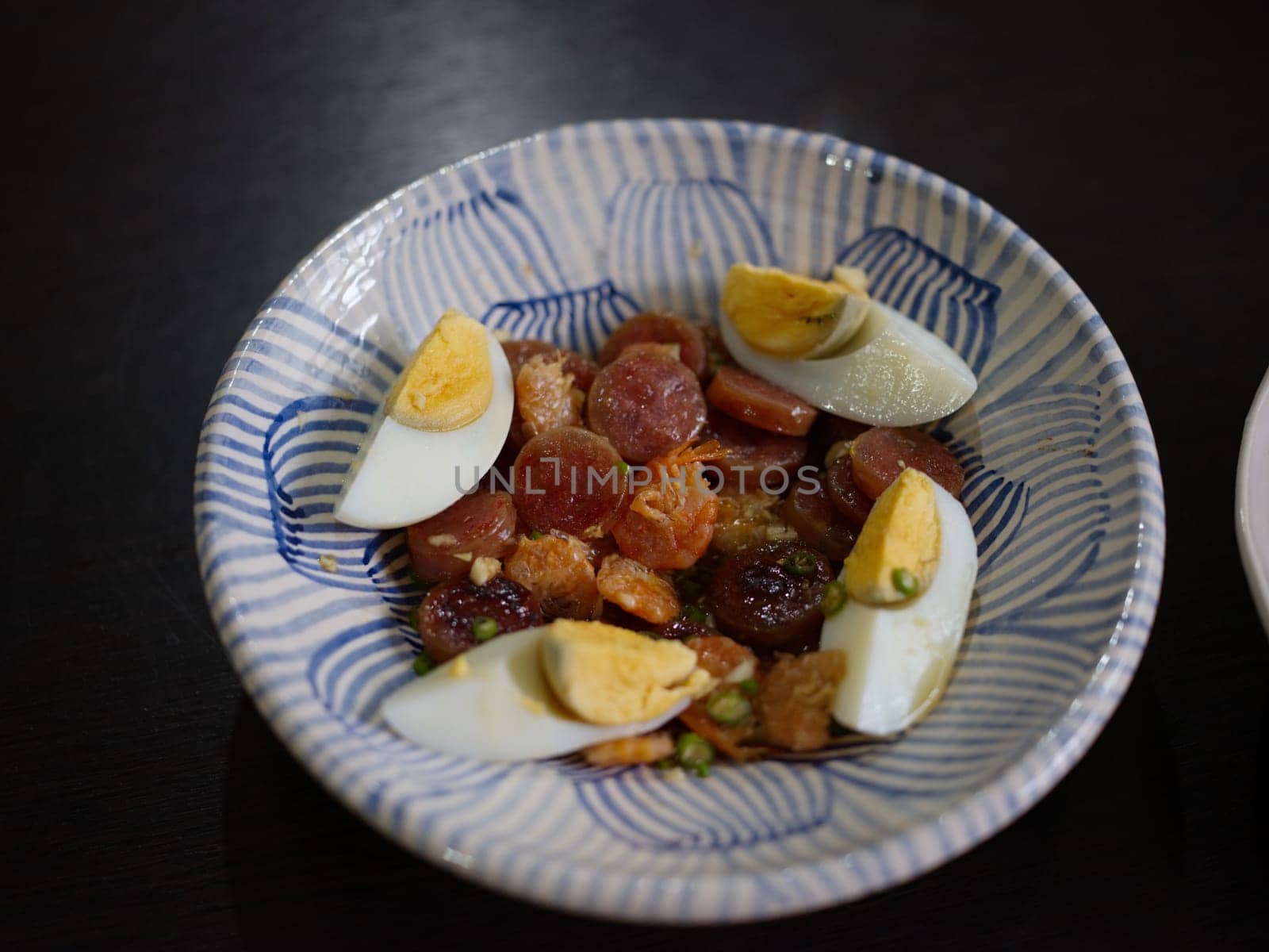 Spicy Chinese pork sausage with boiled egg Thai salad