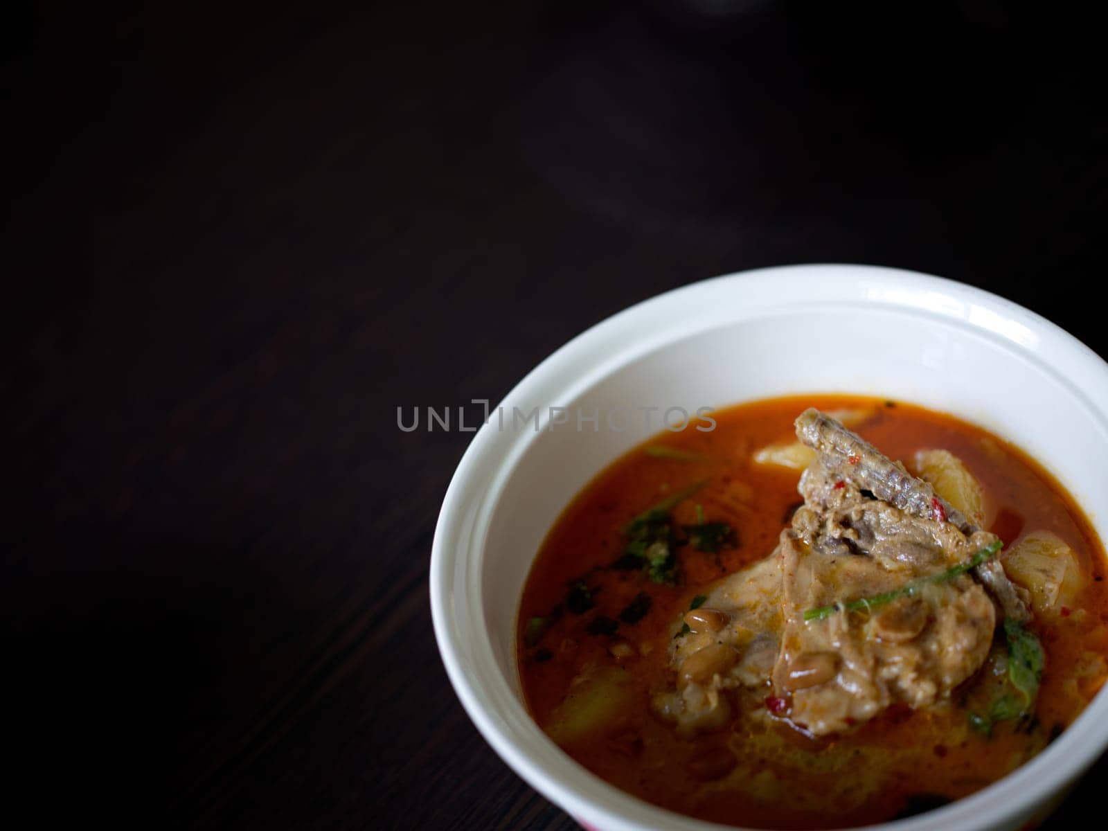 Chicken Mussaman Curry on white bowl