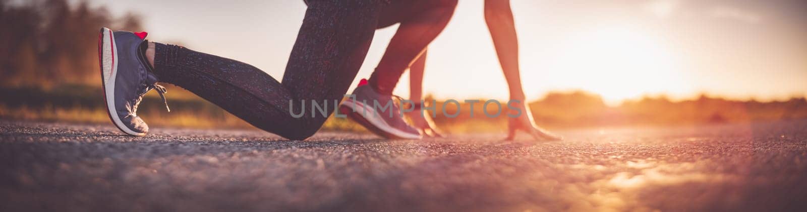 Woman starting to run outdoors in the evening.Concept of healthy lifestyle.