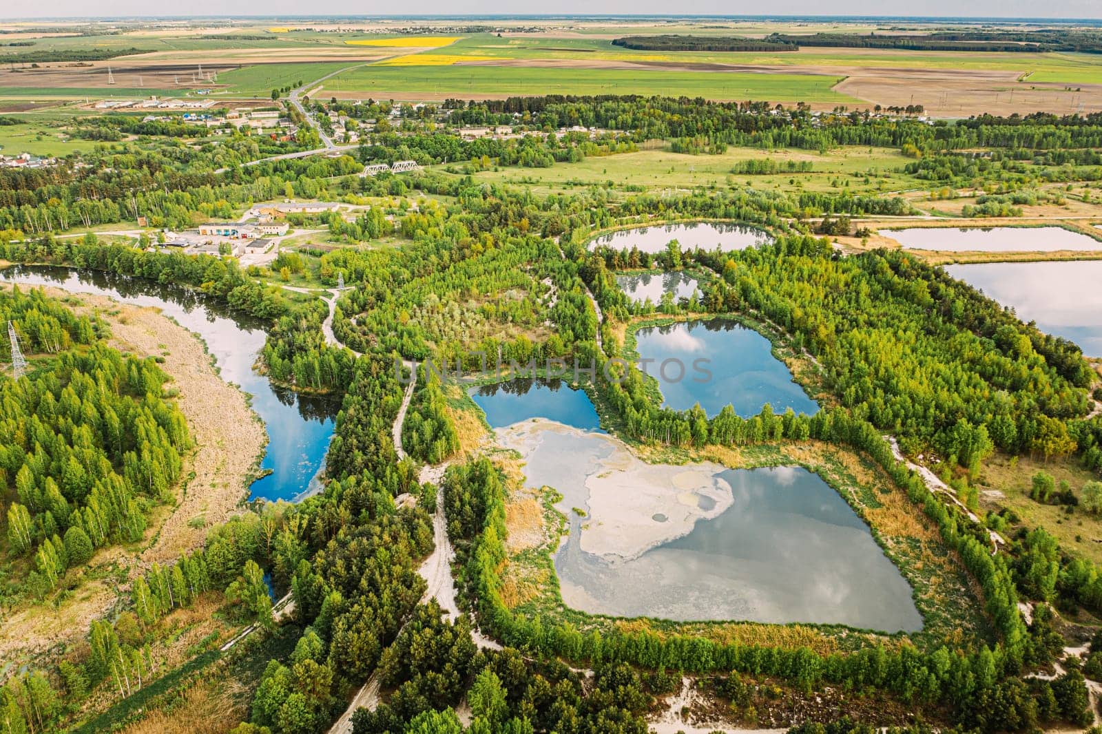 Aerial View Retention Basins, Wet Pond, Wet Detention Basin Or Stormwater Management Pond, Is An Artificial Pond With Vegetation Around The Perimeter, And Includes A Permanent Pool Of Water In Its Design.