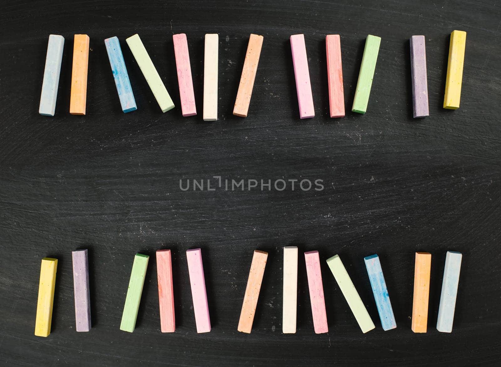 Chalkboard with colorful chalk, copy space for text , back to school, education concept