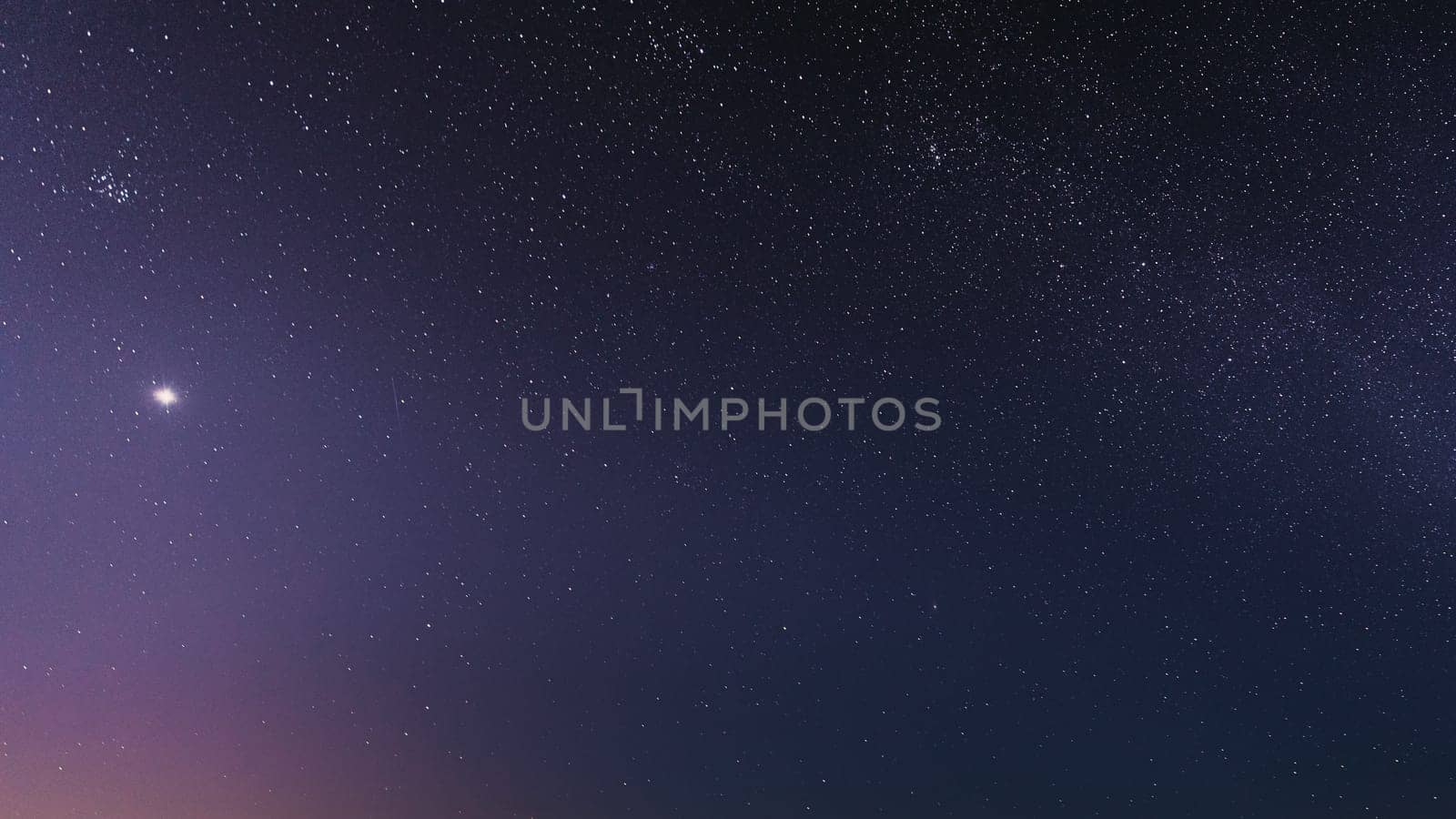 Night Starry Sky With Glowing Stars. Bright Glow Of Planet Venus In Sky Among The Stars. Starry Backdrop Background.