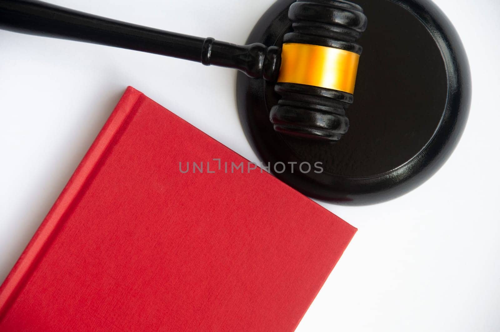 Red cover book and gavel with space customizable for text or ideas. Copy space