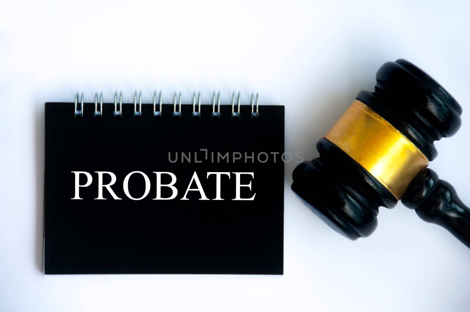 Probate text on black notepad and gavel on white cover background. Law concept