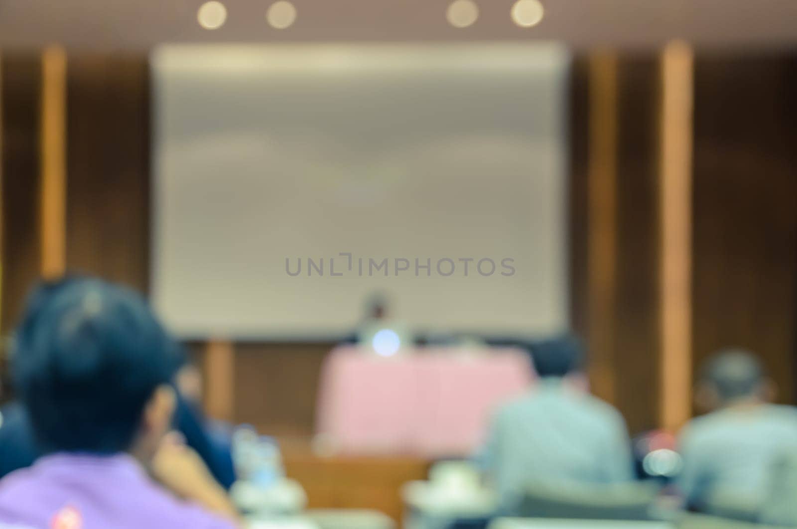 Abstract blurred people lecture in conference or seminar room. Business or education concept background