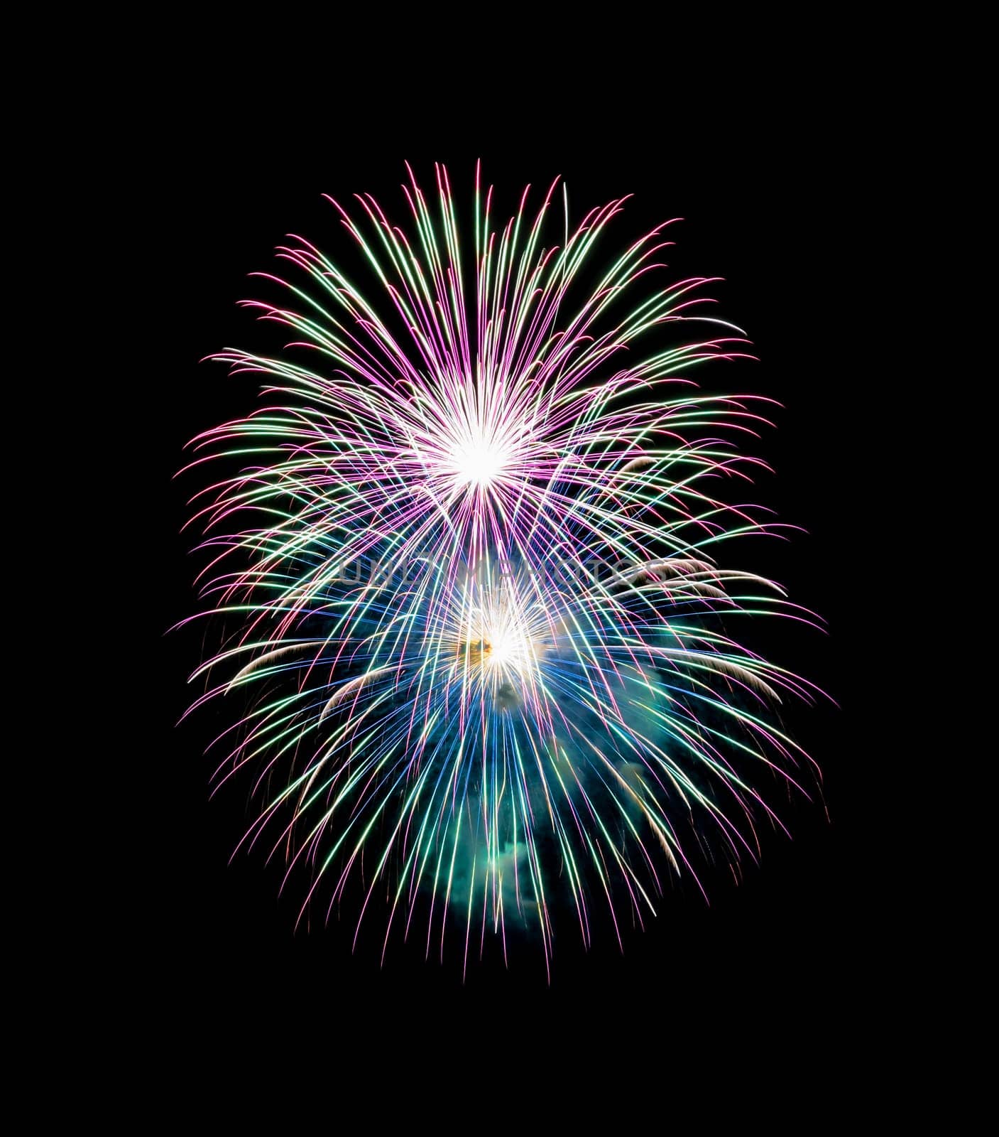 Night colorful fireworks on black background. Beautiful lights for celebration.