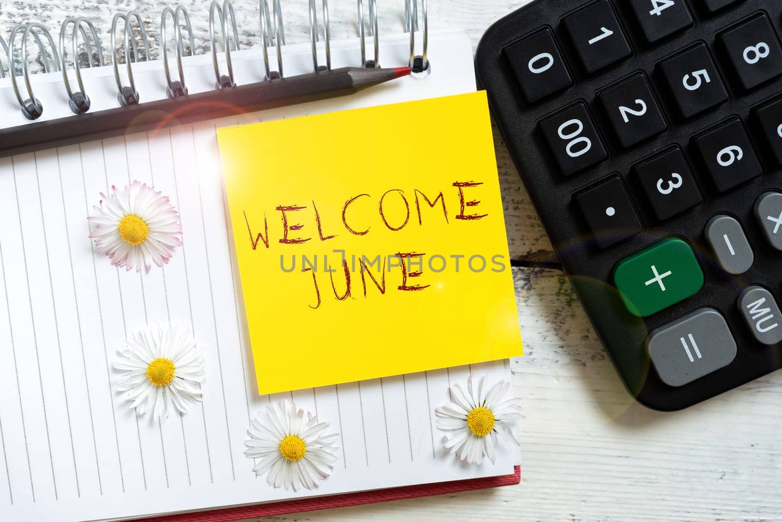 Sign displaying Welcome June, Business overview Calendar Sixth Month Second Quarter Thirty days Greetings Note With Important Message Over Notebook With Flowers Around.