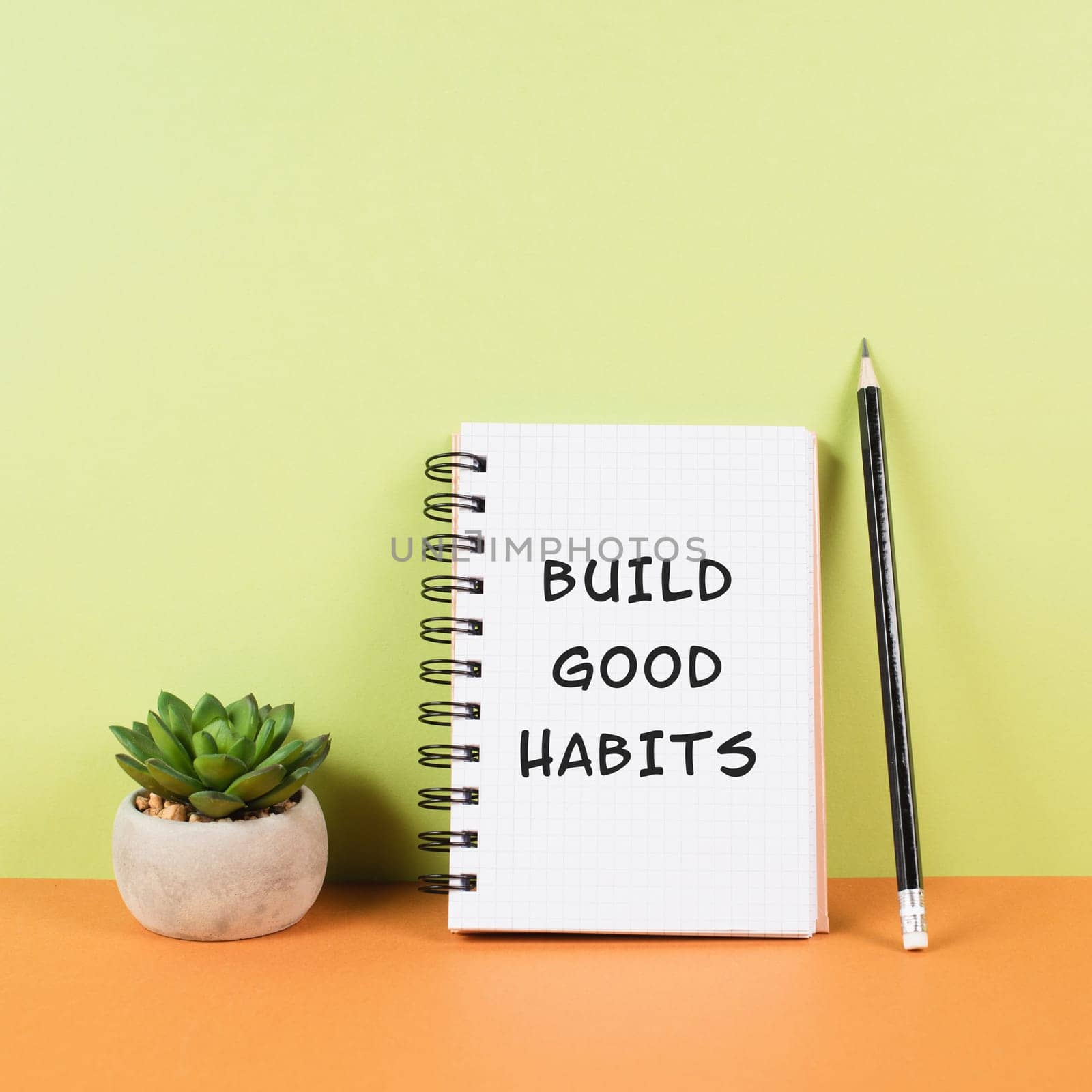 The words build good habits are standing on a notebook, change lifestyle, healthy and positive attidude, motivation concept