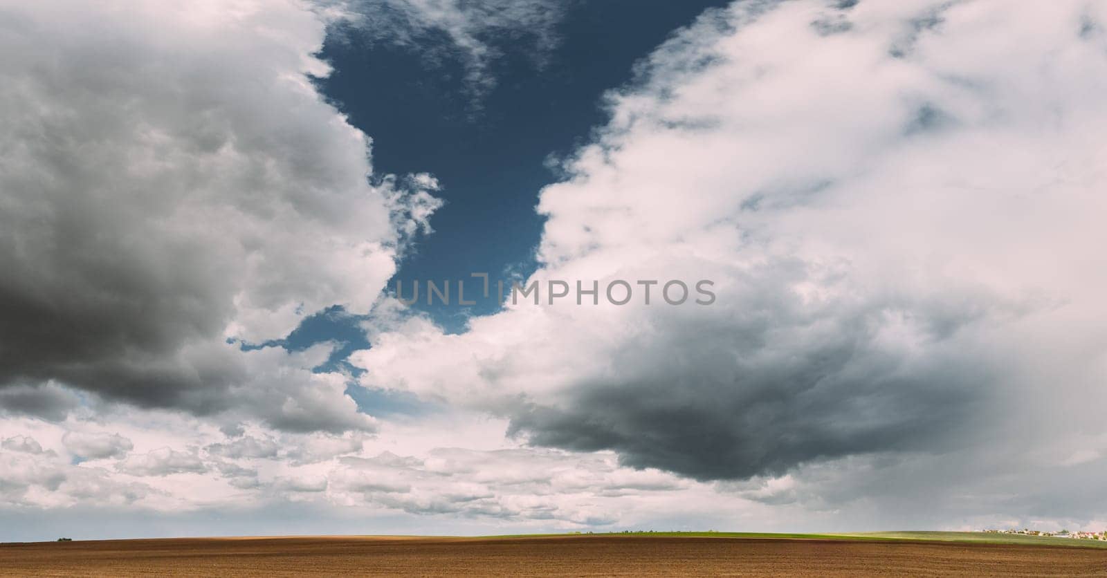 Countryside Rural Field Landscape With Empty Brown Soil. Early Spring Agricultural Season.