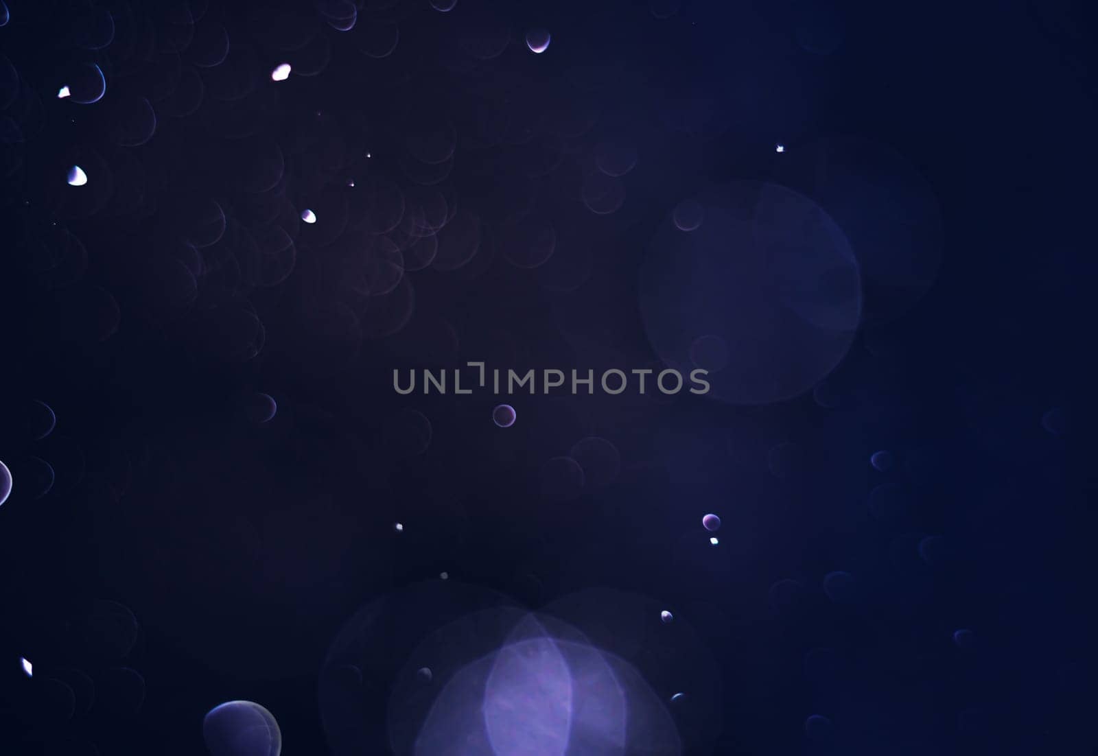 Light abstract dark bokeh christmas circle color glitter blurred black background