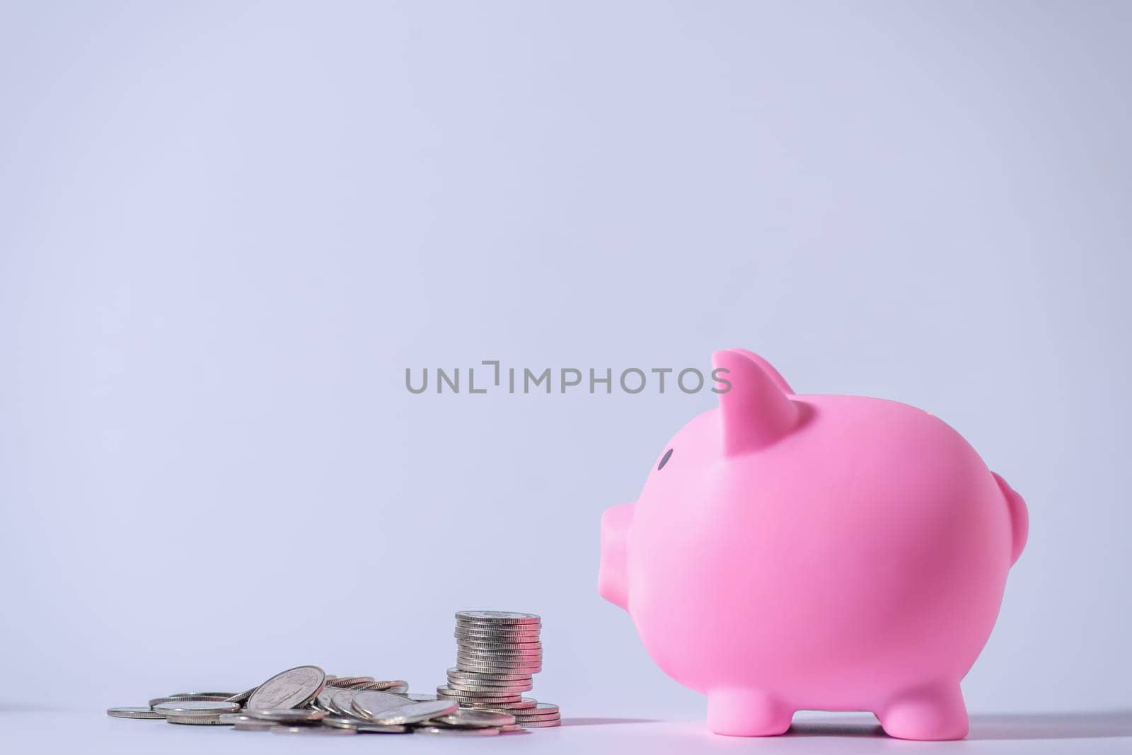 Save money and account banking for finance concept, Piggy bank with coin on blurred background, Save Monney for Investors Using Internet to Trade Stocks or Trade Fund