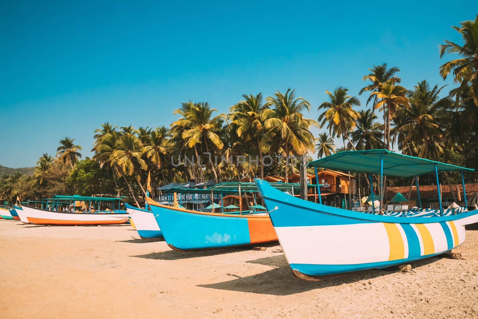 Canacona, Goa, India. Sightseeing Tourist Boats Parked On Famous Palolem Beach In Summer Sunny Day.