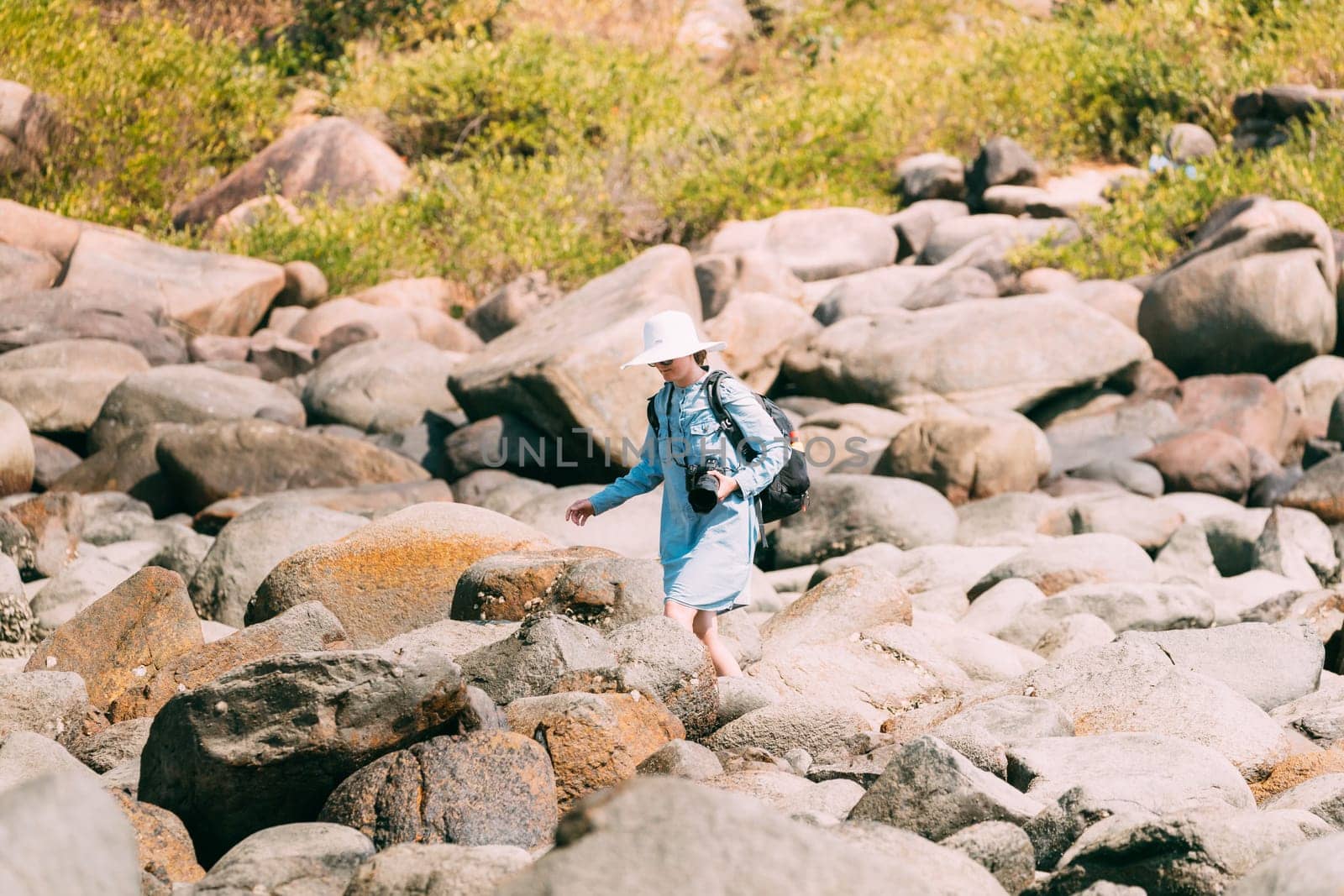 Kanica, Goa, India. People Standing On Pile Of Stones And Taking Photo At Sunny Summer Day.