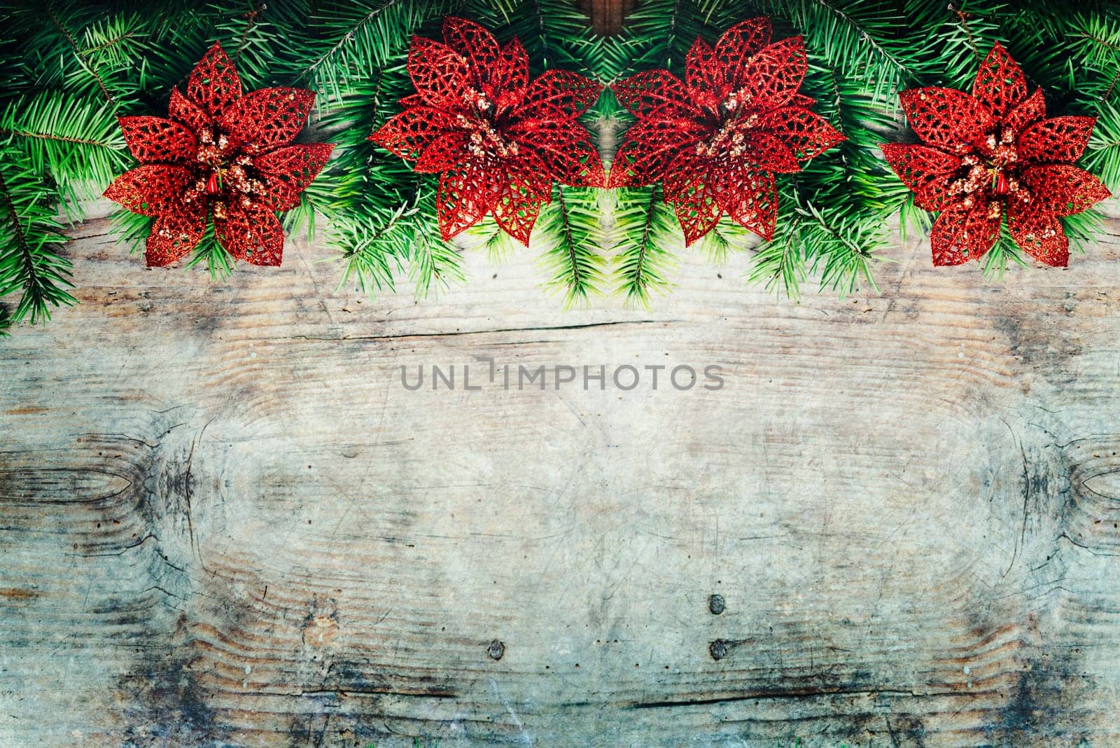 Top view of fir tree branches and decoration border. Christmas holiday and new year decorative wooden grunge textured background design with copyspace.