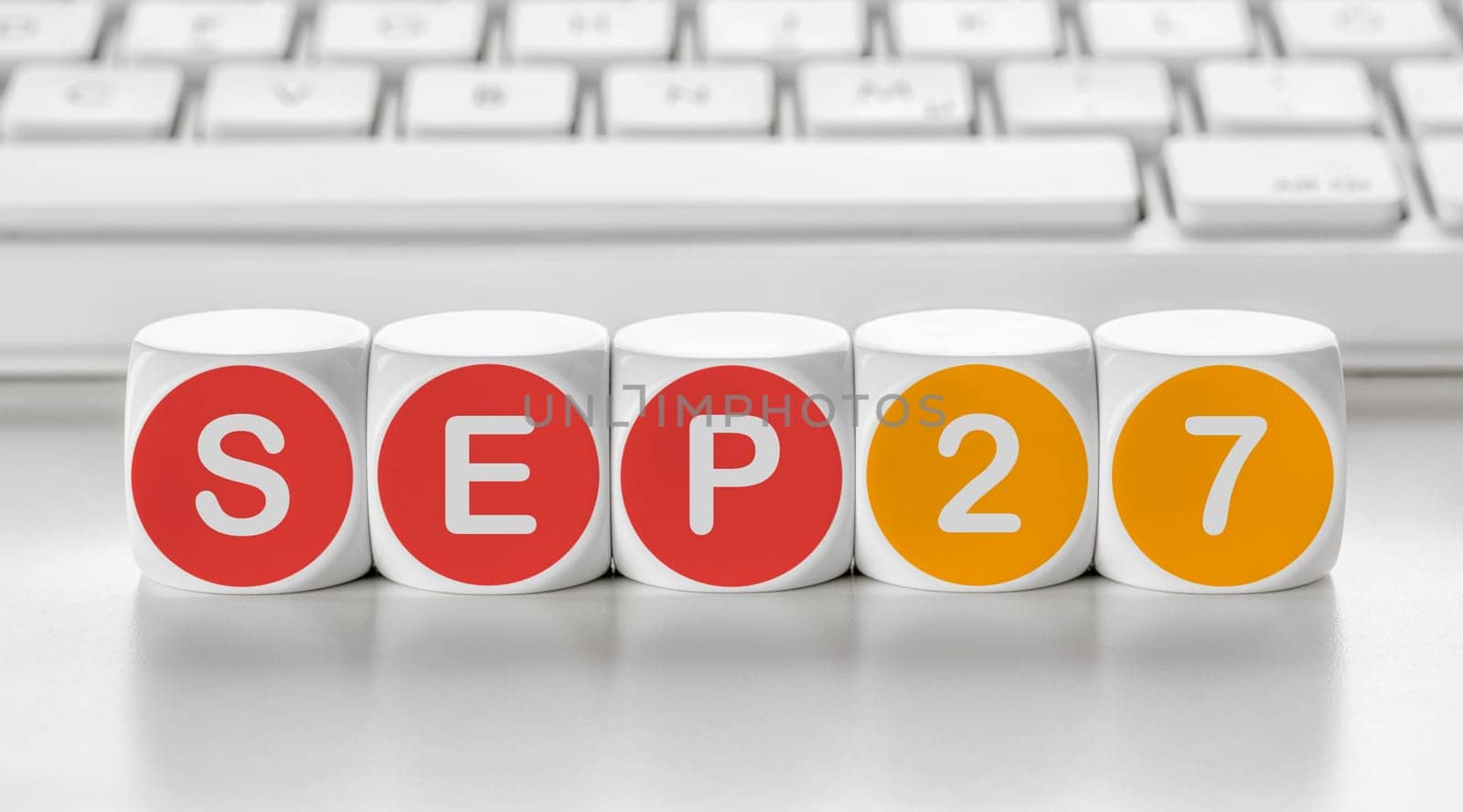 Letter dice in front of a keyboard - September 27