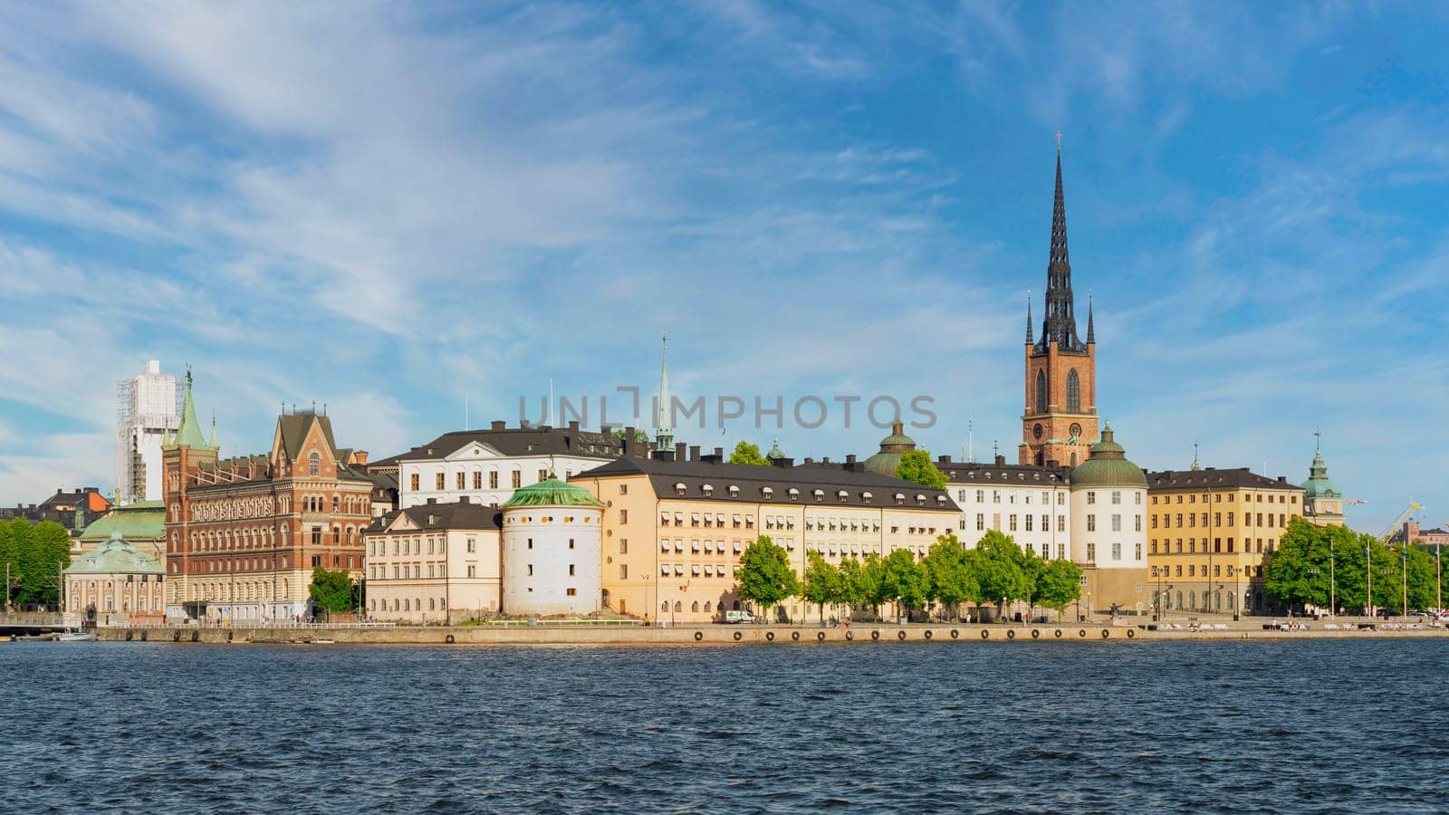 Stockholm, Sweden - June 25 2022: View from City Hall overlooking Riddarholmshamnen Island, with Norstedt Building, Birger Jarl's Tower, Supreme Administrative Court, and Riddarholmen Church tower