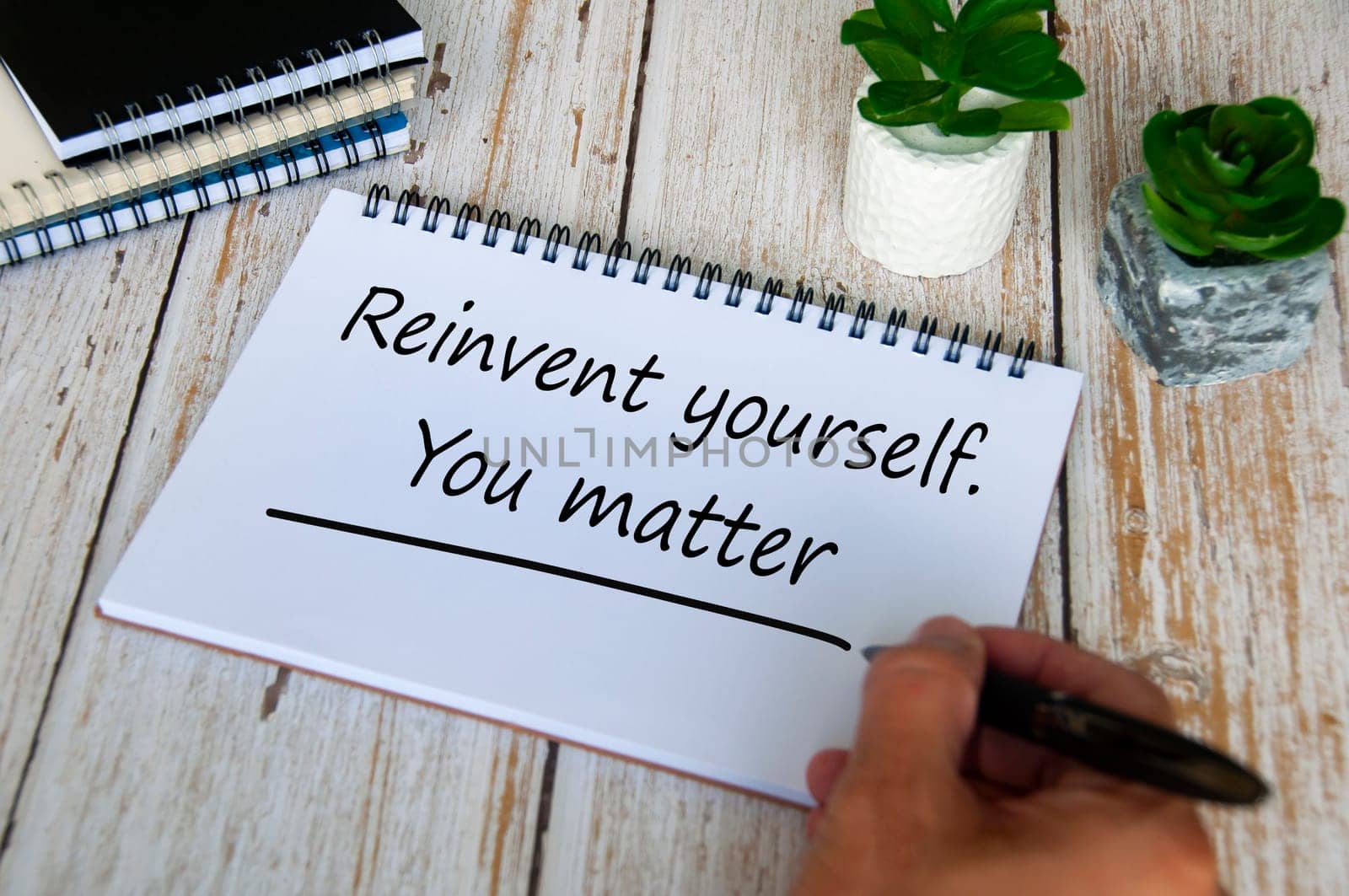 Reinvent yourself. You matter text on notepad. Motivational and inspirational concept.